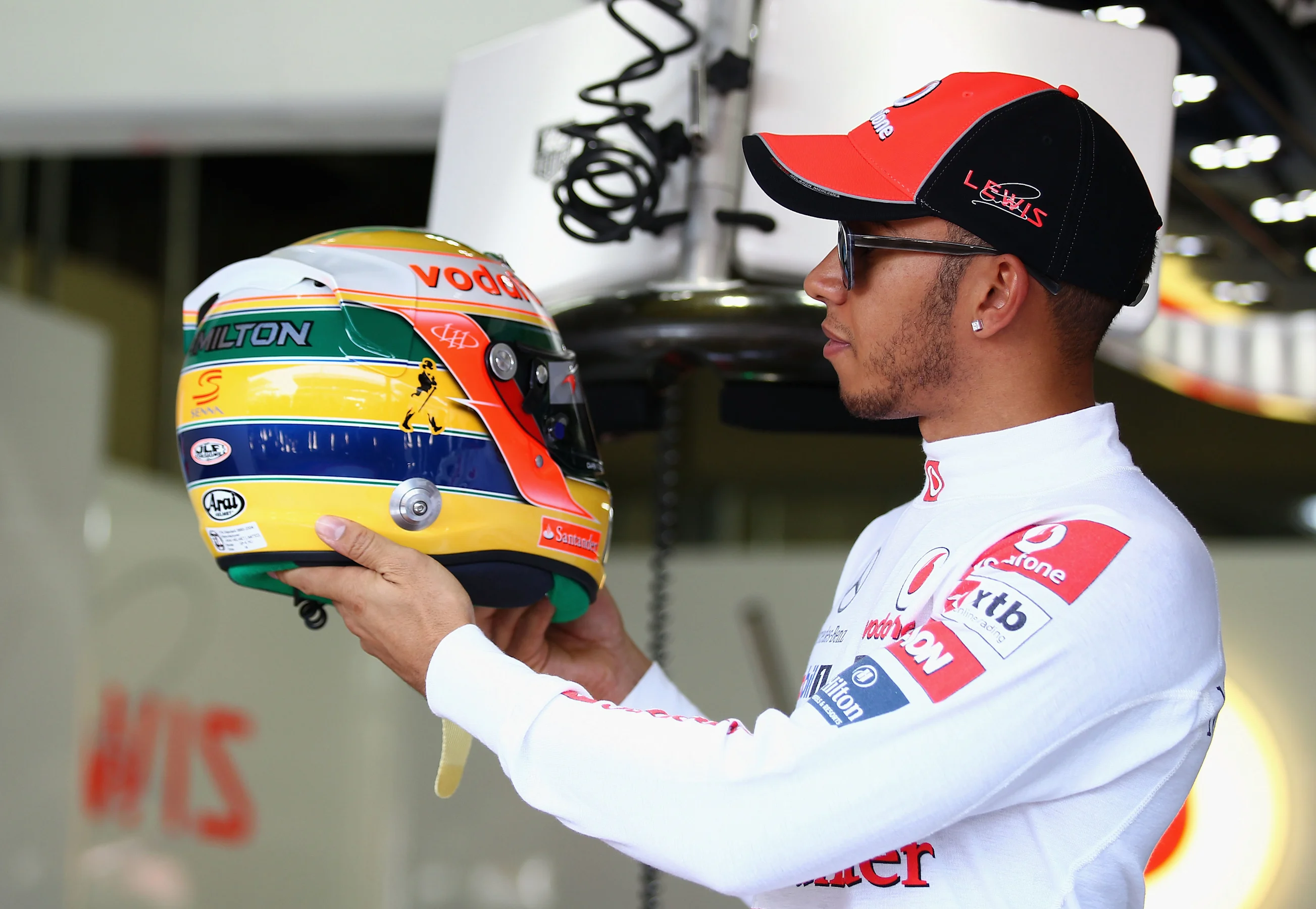 SAO PAULO, BRAZIL - NOVEMBER 25:  Lewis Hamilton of Great Britain and McLaren shows his specially