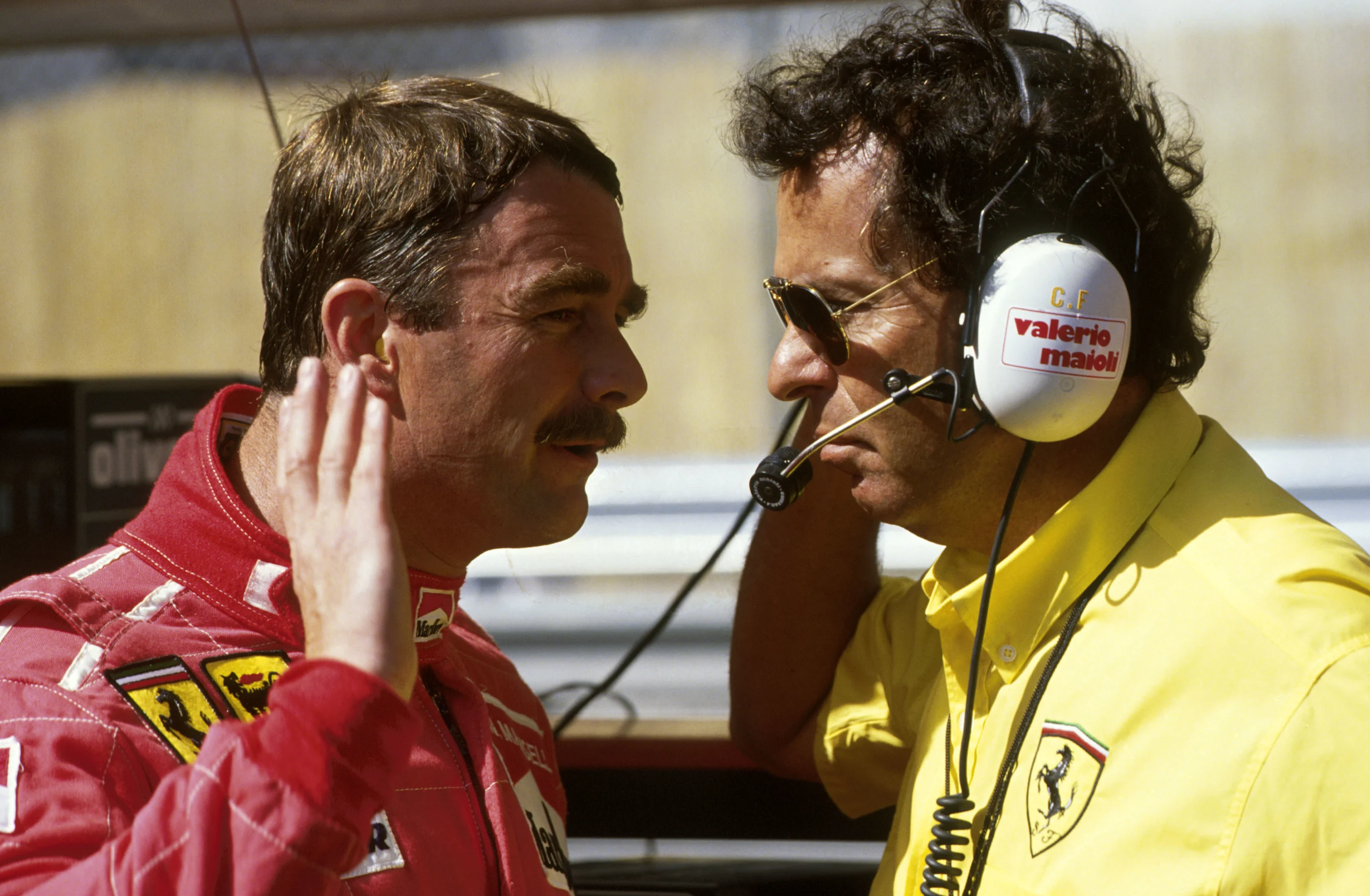 Nigel Mansell (GBR) Ferrari 641 speaks to Cesare Fiorio, Ferrari Team Manager, right Monaco Grand