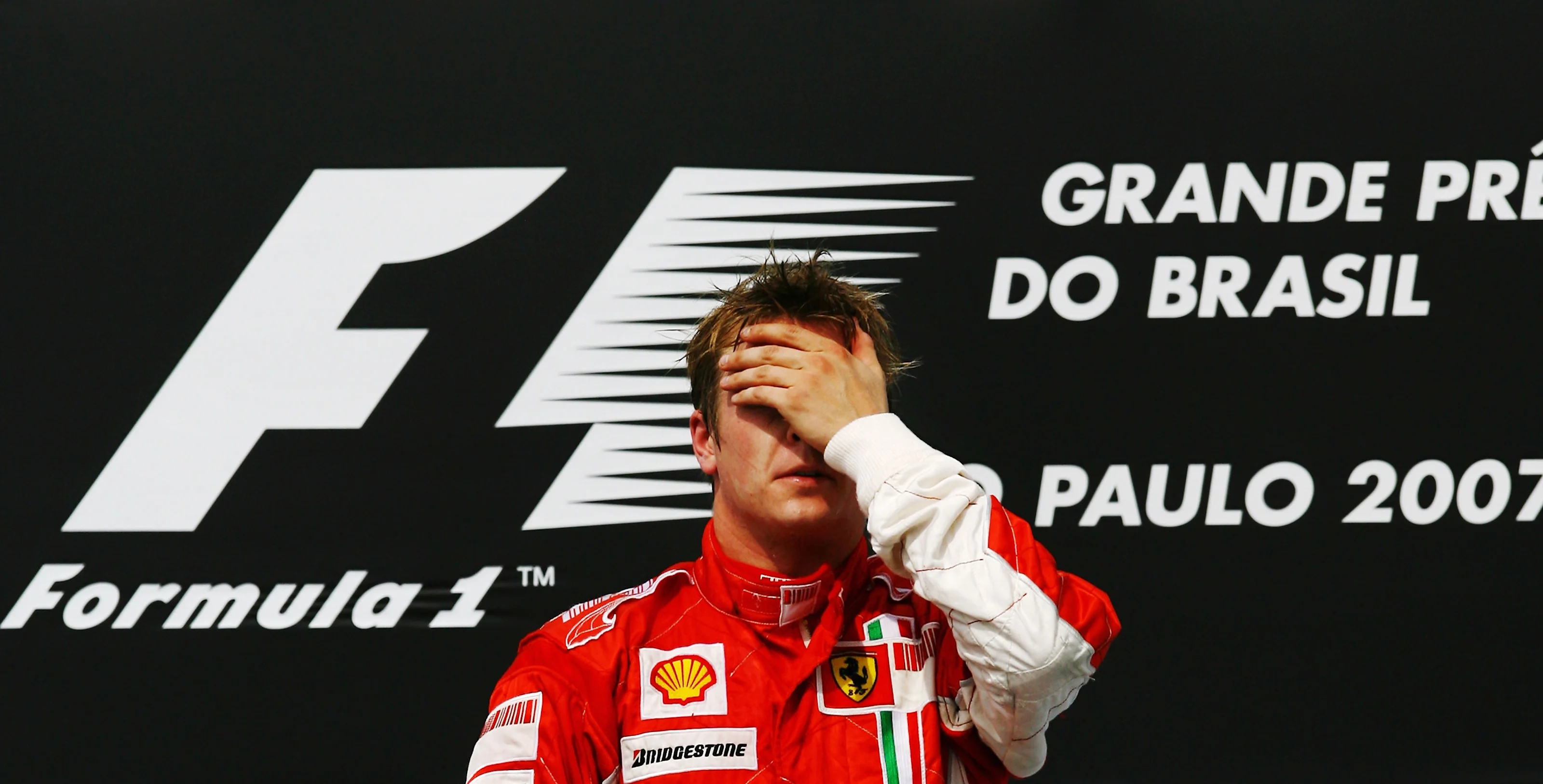 SAO PAULO, BRAZIL - OCTOBER 21: Kimi Raikkonen of Finland and Ferrari celebrates on the podium