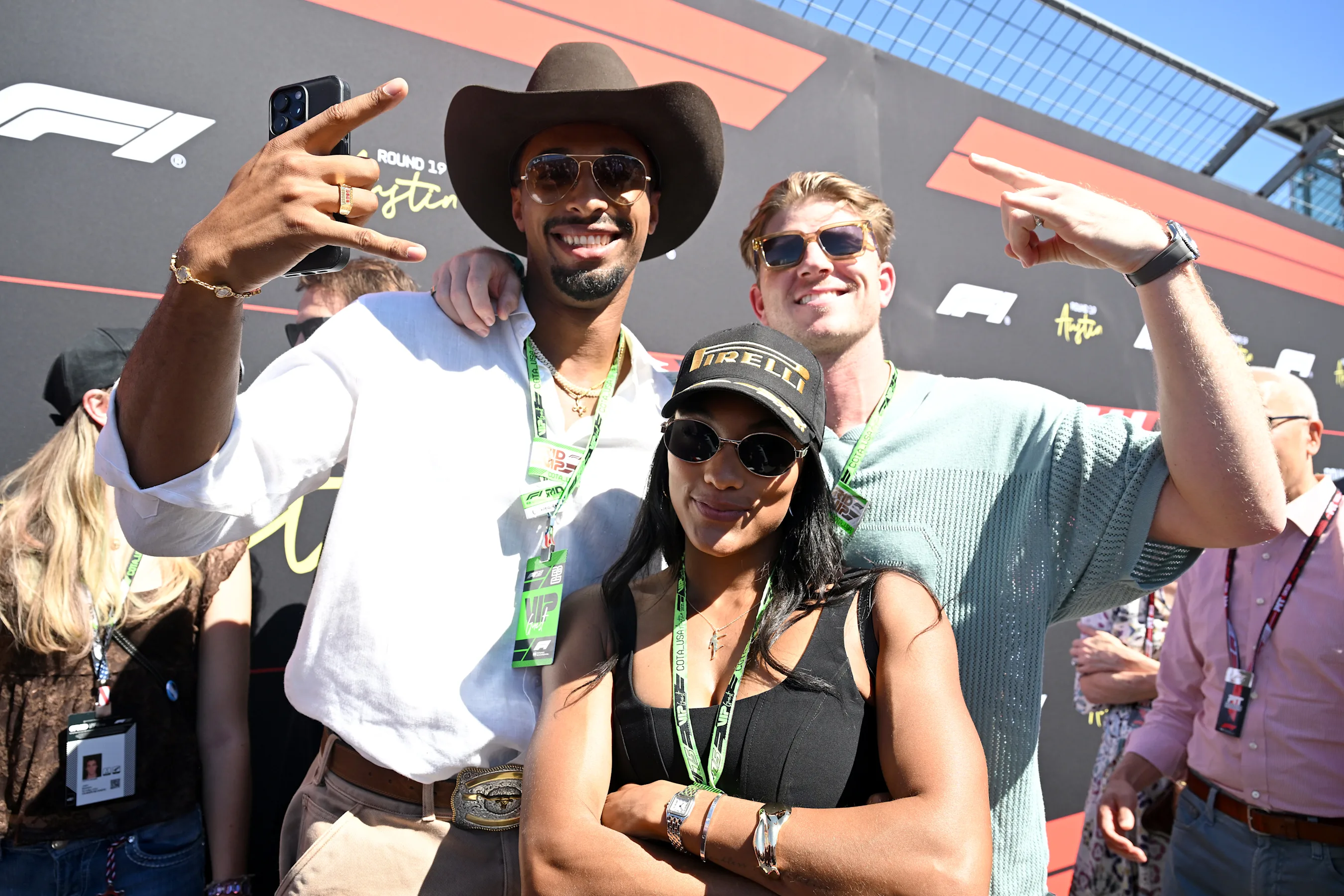 AUSTIN, TEXAS - OCTOBER 19: Leo Neugebauer and Tara Davis-Woodhall on the grid during the F1 Grand