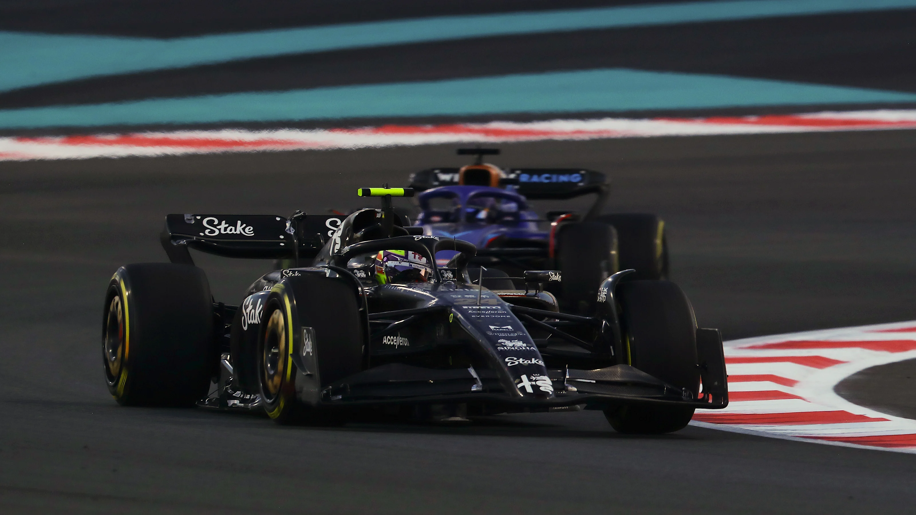 ABU DHABI, UNITED ARAB EMIRATES - NOVEMBER 26: Zhou Guanyu of China driving the (24) Alfa Romeo F1
