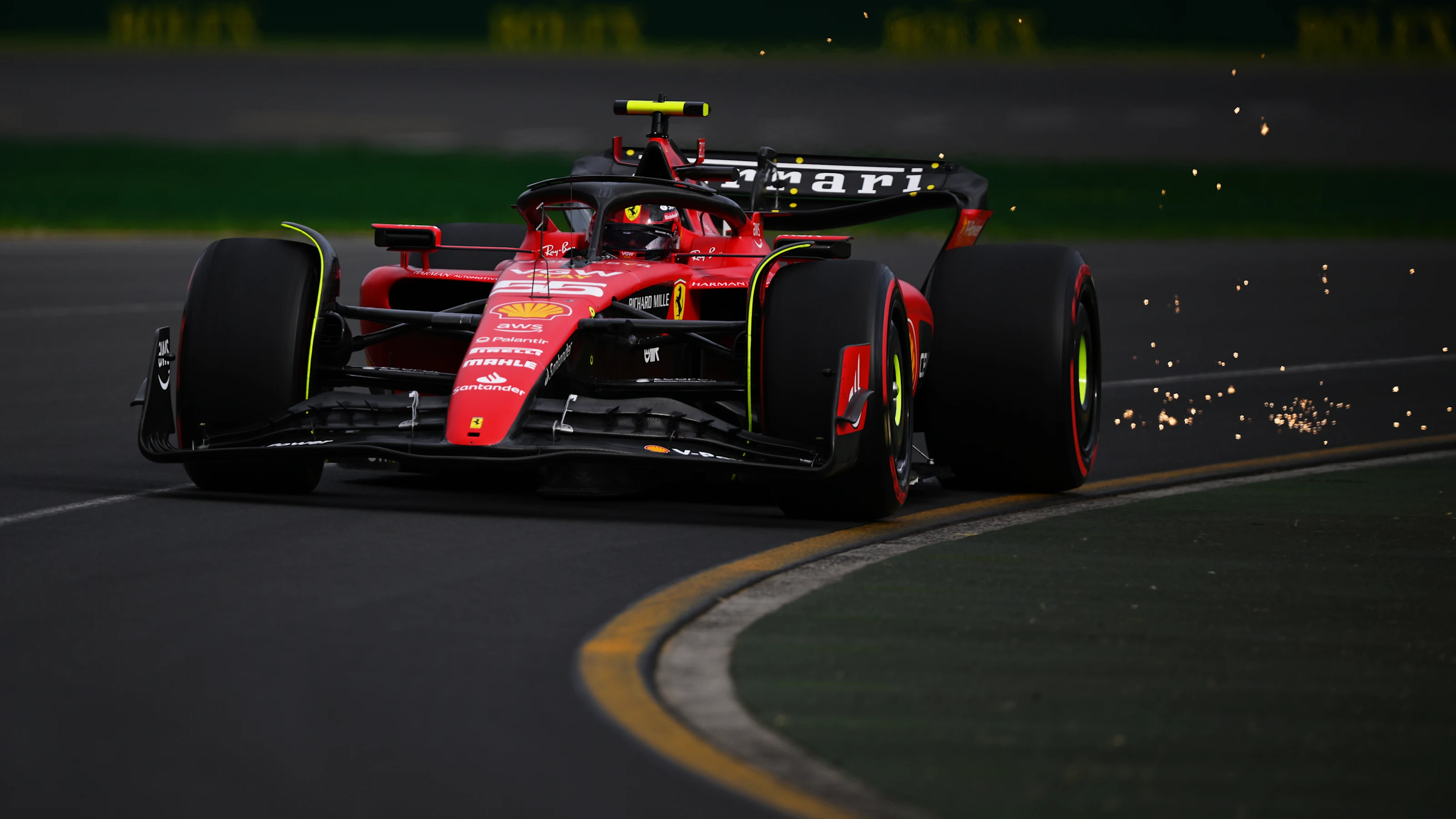 MELBOURNE, AUSTRALIA - APRIL 01: Sparks fly behind Carlos Sainz of Spain driving (55) the Ferrari