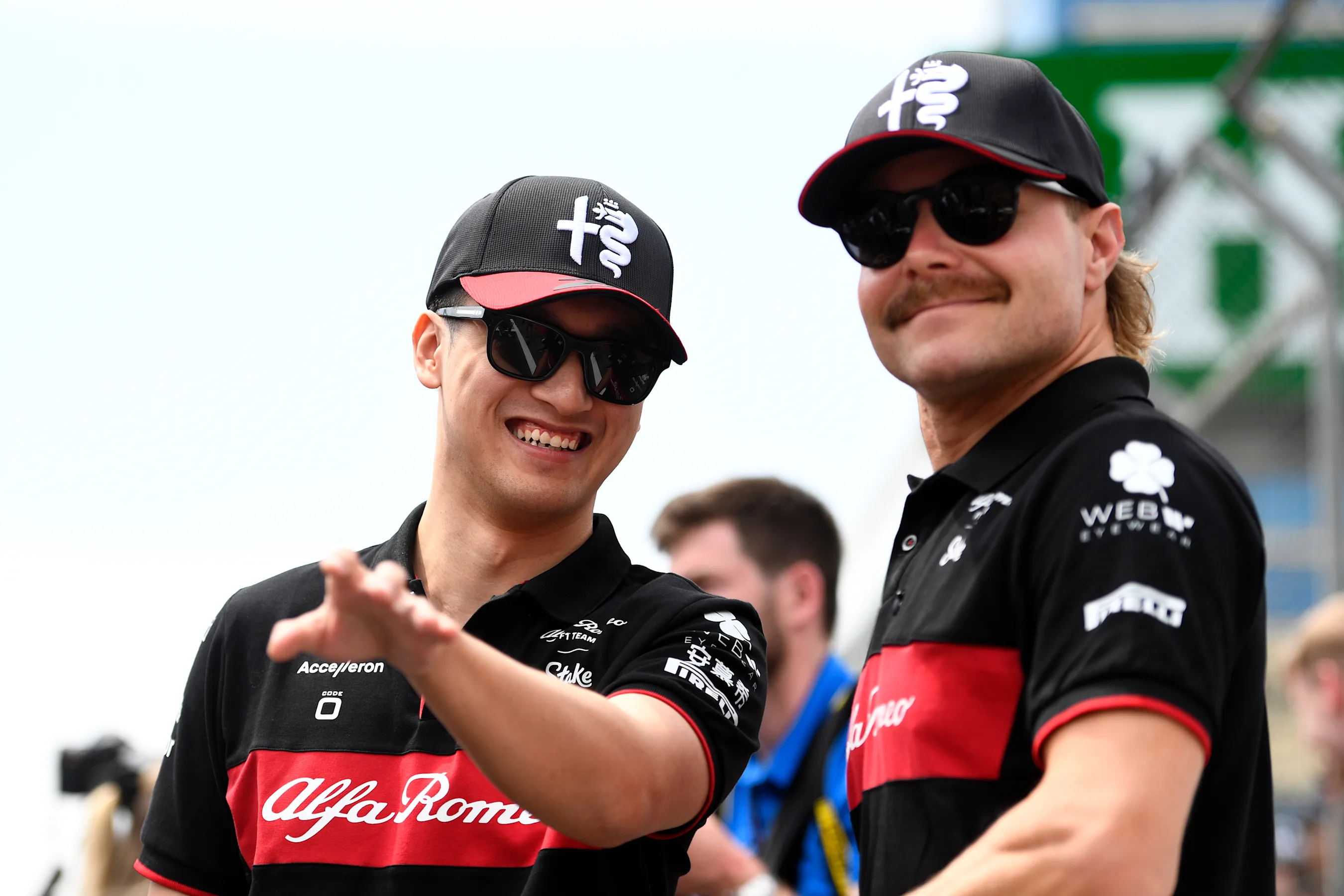 BAKU, AZERBAIJAN - APRIL 30: Zhou Guanyu of China and Alfa Romeo F1 talks with Valtteri Bottas of