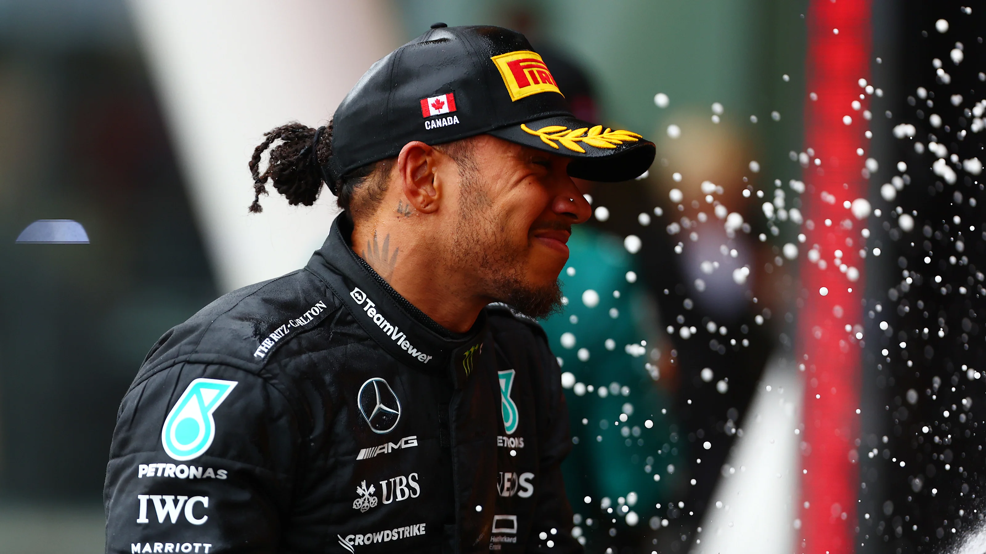 MONTREAL, QUEBEC - JUNE 18: Third placed Lewis Hamilton of Great Britain and Mercedes celebrates on