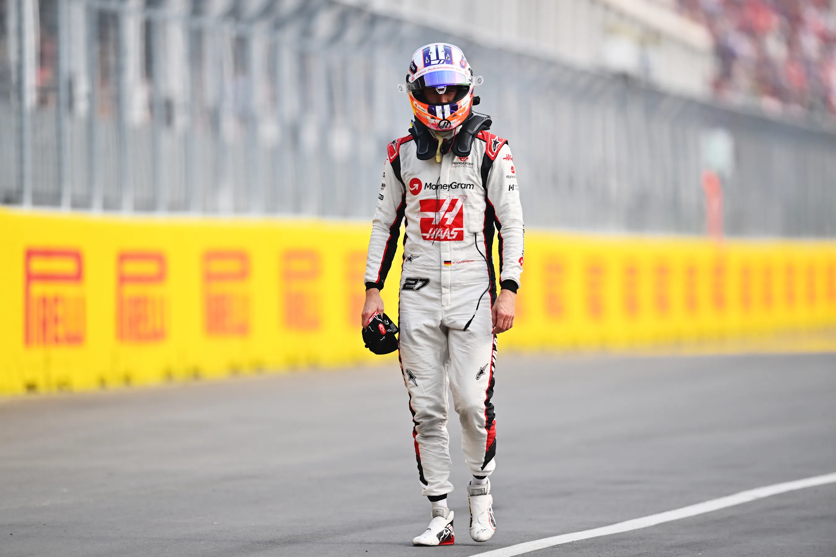 MONTREAL, QUEBEC - JUNE 16: Nico Hulkenberg of Germany and Haas F1 walks back to the garage after