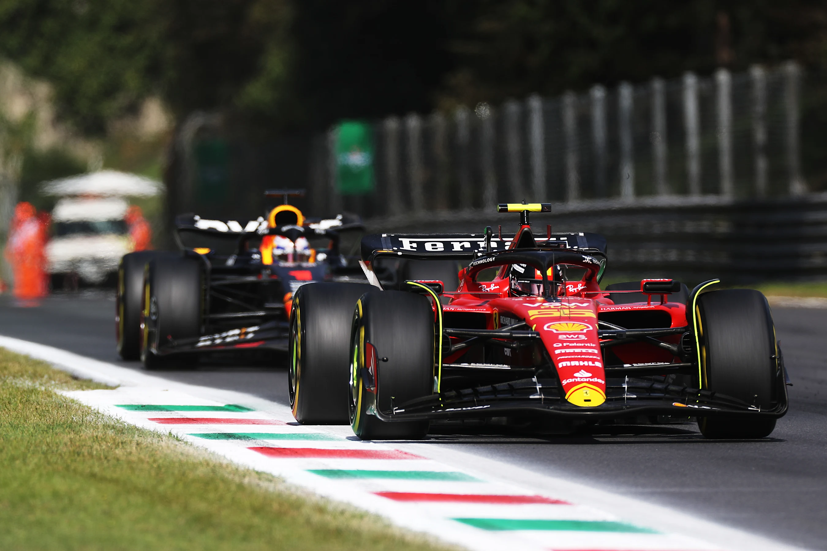 MONZA, ITALY - SEPTEMBER 03: Carlos Sainz of Spain driving (55) the Ferrari SF-23 leads Max