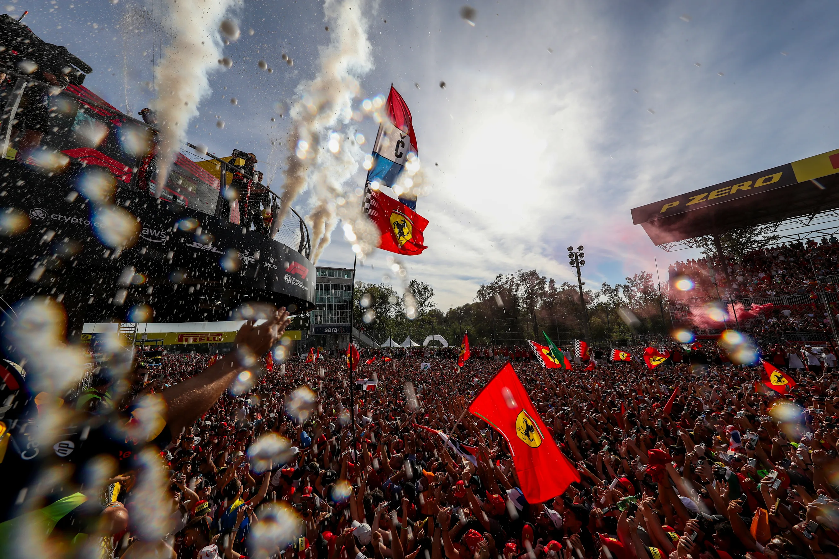 MONZA, ITALY - SEPTEMBER 03: The tifosi celebrate with Max Verstappen of Red Bull Racing and The