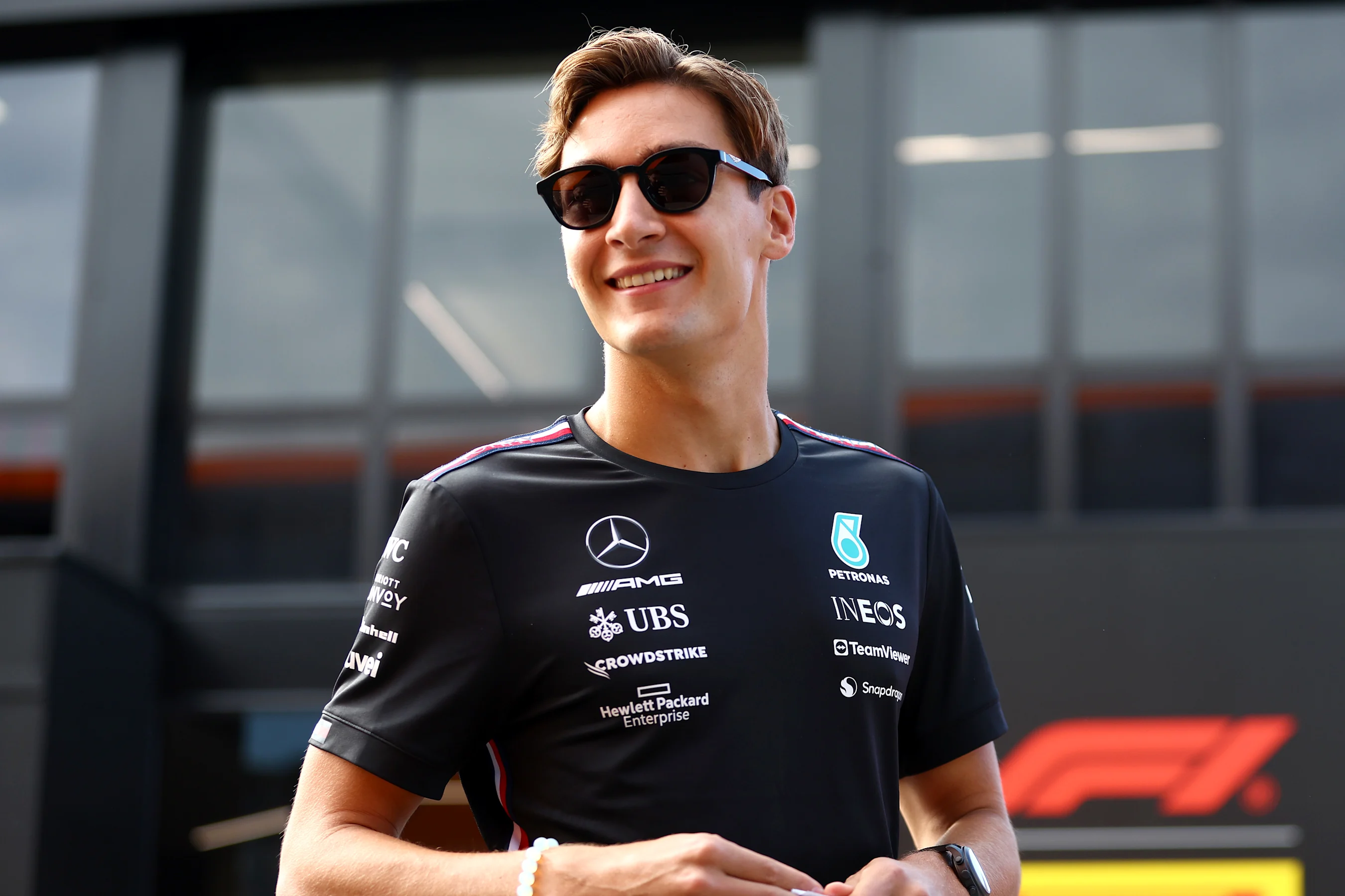 MONZA, ITALY - SEPTEMBER 01: George Russell of Great Britain and Mercedes walks in the Paddock