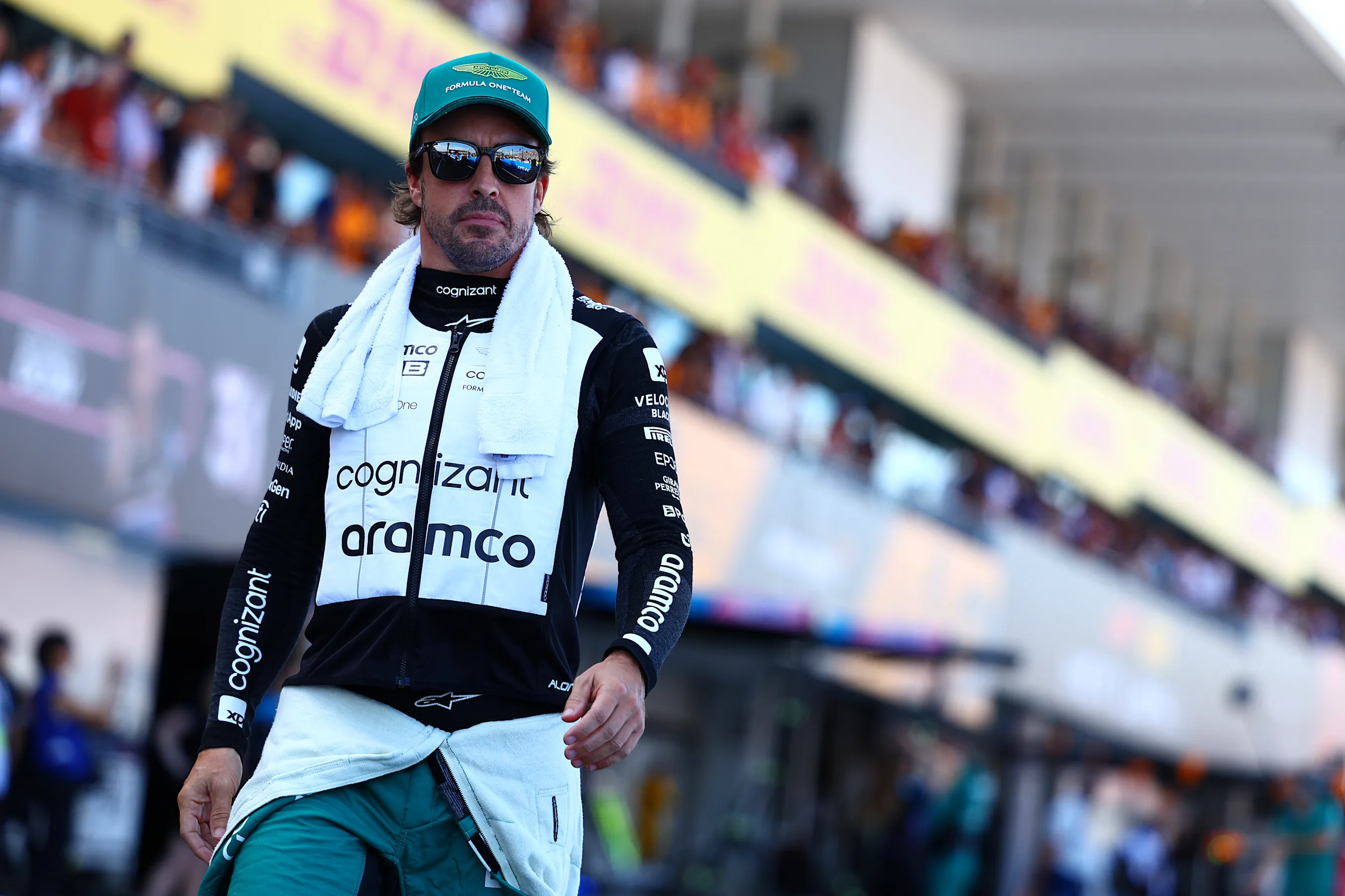 SUZUKA, JAPAN - SEPTEMBER 24: Fernando Alonso of Spain and Aston Martin F1 Team walks in the