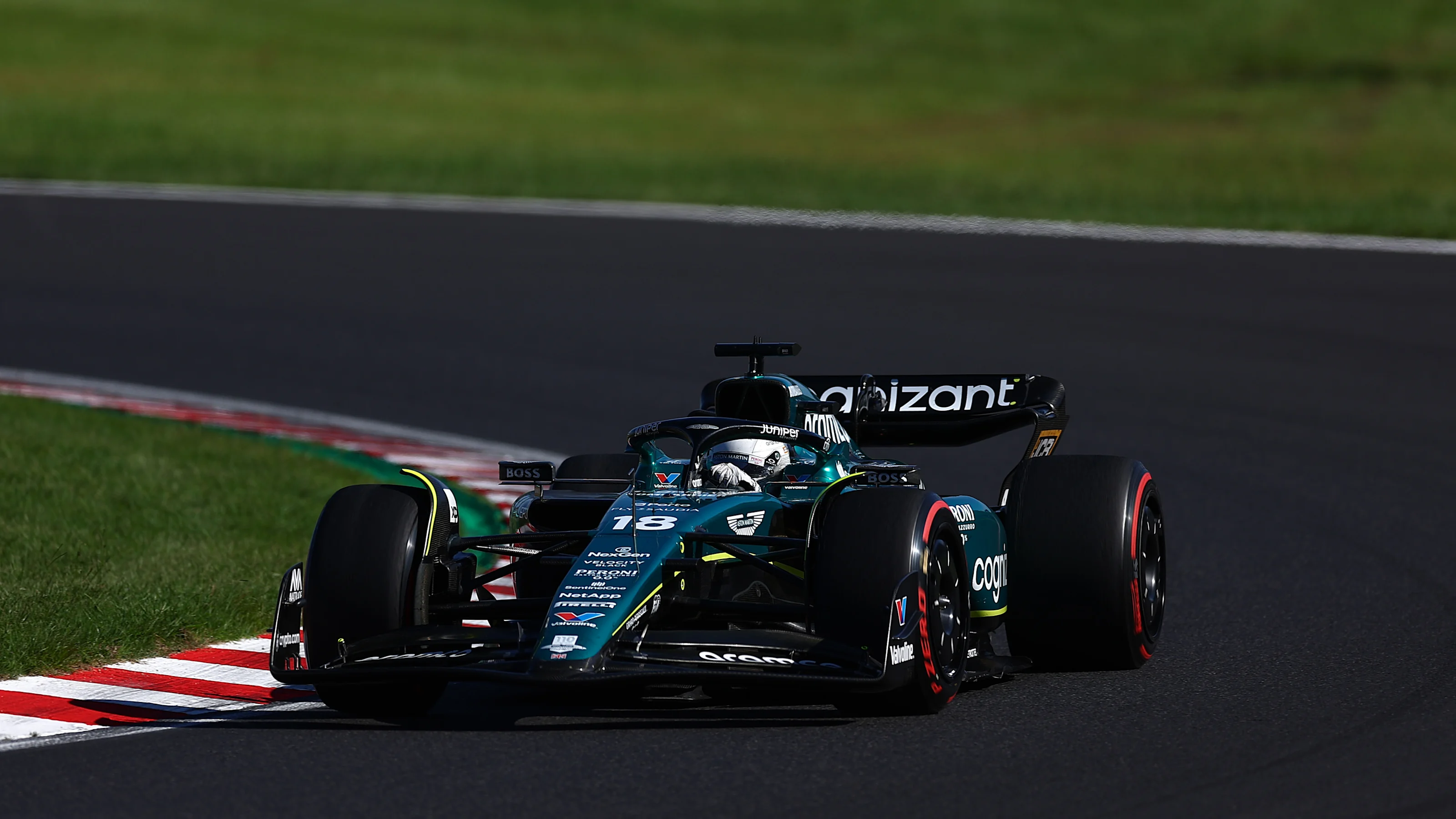 SUZUKA, JAPAN - SEPTEMBER 24: Lance Stroll of Canada driving the (18) Aston Martin AMR23 Mercedes