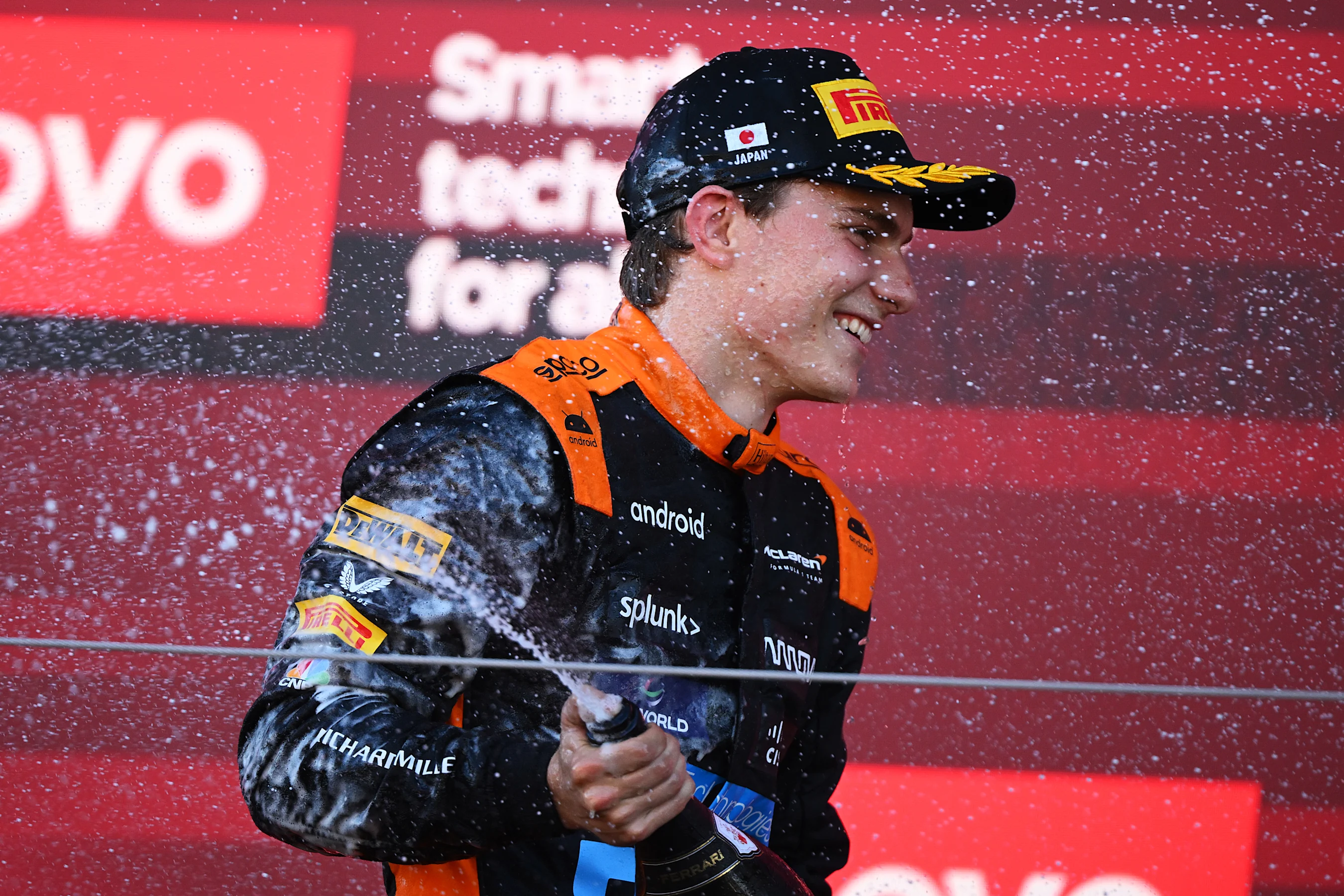 SUZUKA, JAPAN - SEPTEMBER 24: Third placed Oscar Piastri of Australia and McLaren celebrates on the