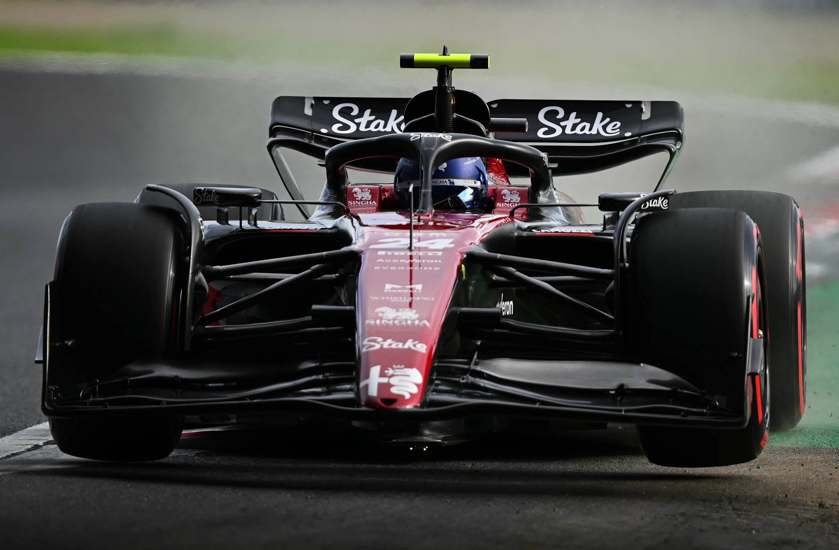 SUZUKA, JAPAN - SEPTEMBER 23: Zhou Guanyu of China driving the (24) Alfa Romeo F1 C43 Ferrari on