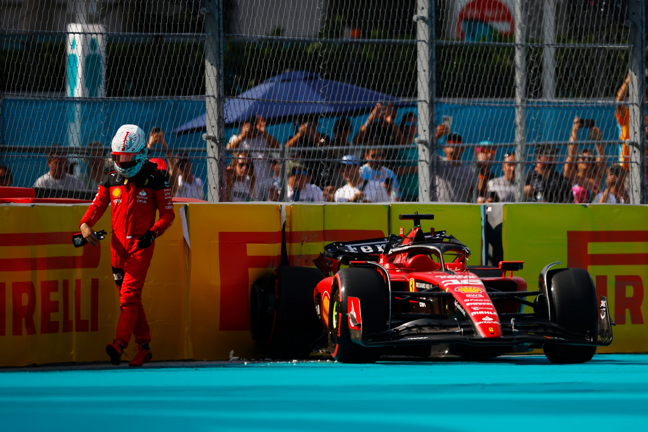 MIAMI, FLORIDA - MAY 06: Charles Leclerc of Monaco and Ferrari walks from his car after crashing