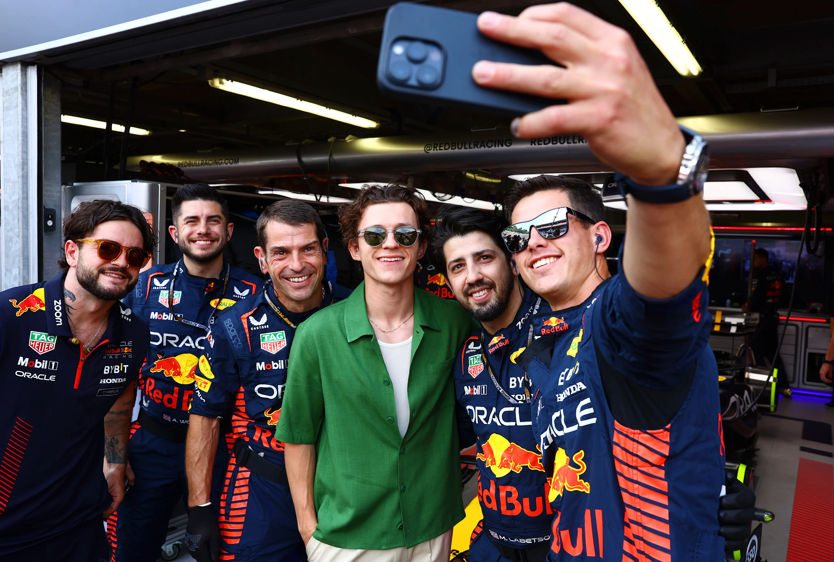 MONTE-CARLO, MONACO - MAY 28: Tom Holland poses for a photo with Red Bull Racing team members