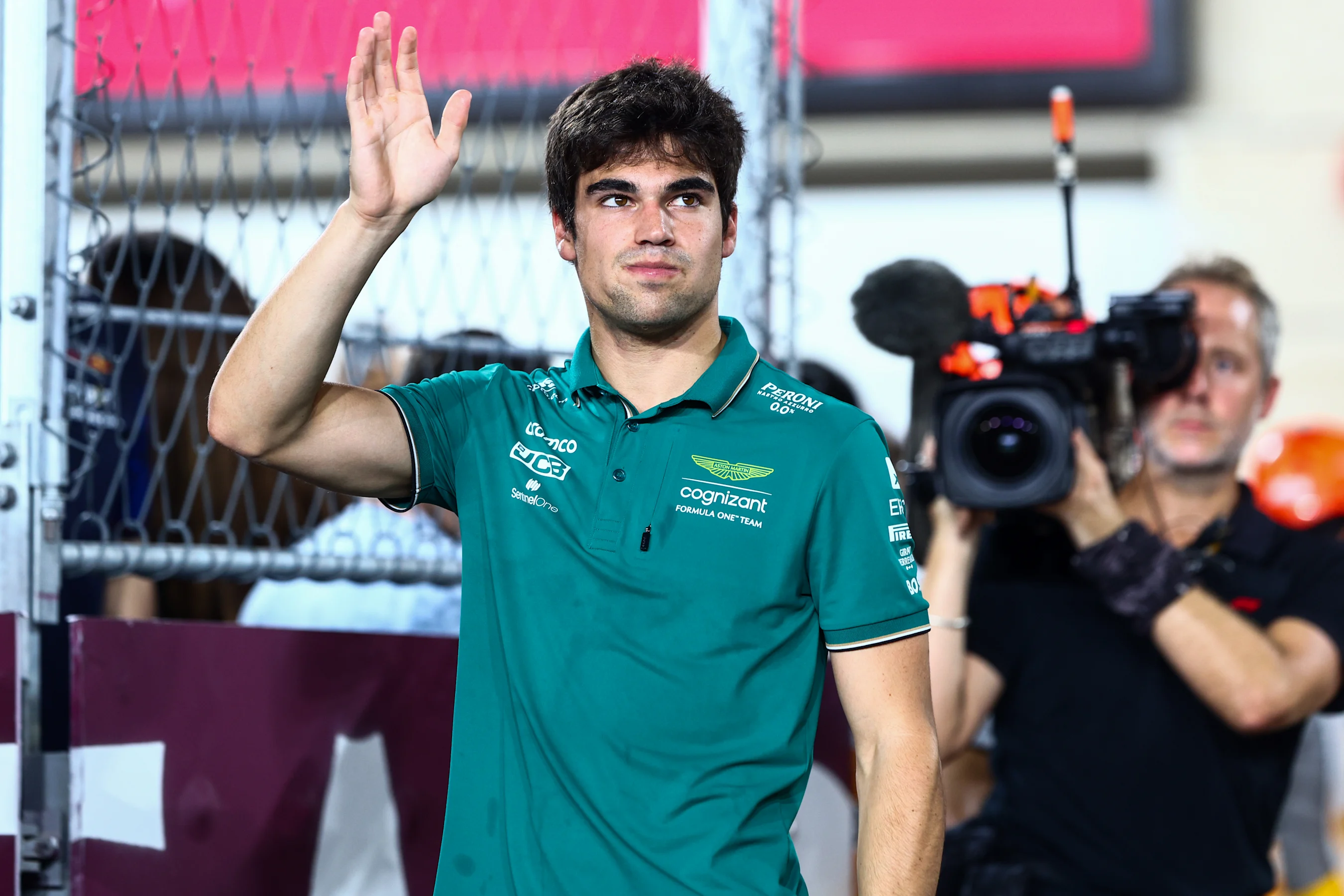LUSAIL CITY, QATAR - OCTOBER 08: Lance Stroll of Canada and Aston Martin F1 Team waves to the crowd