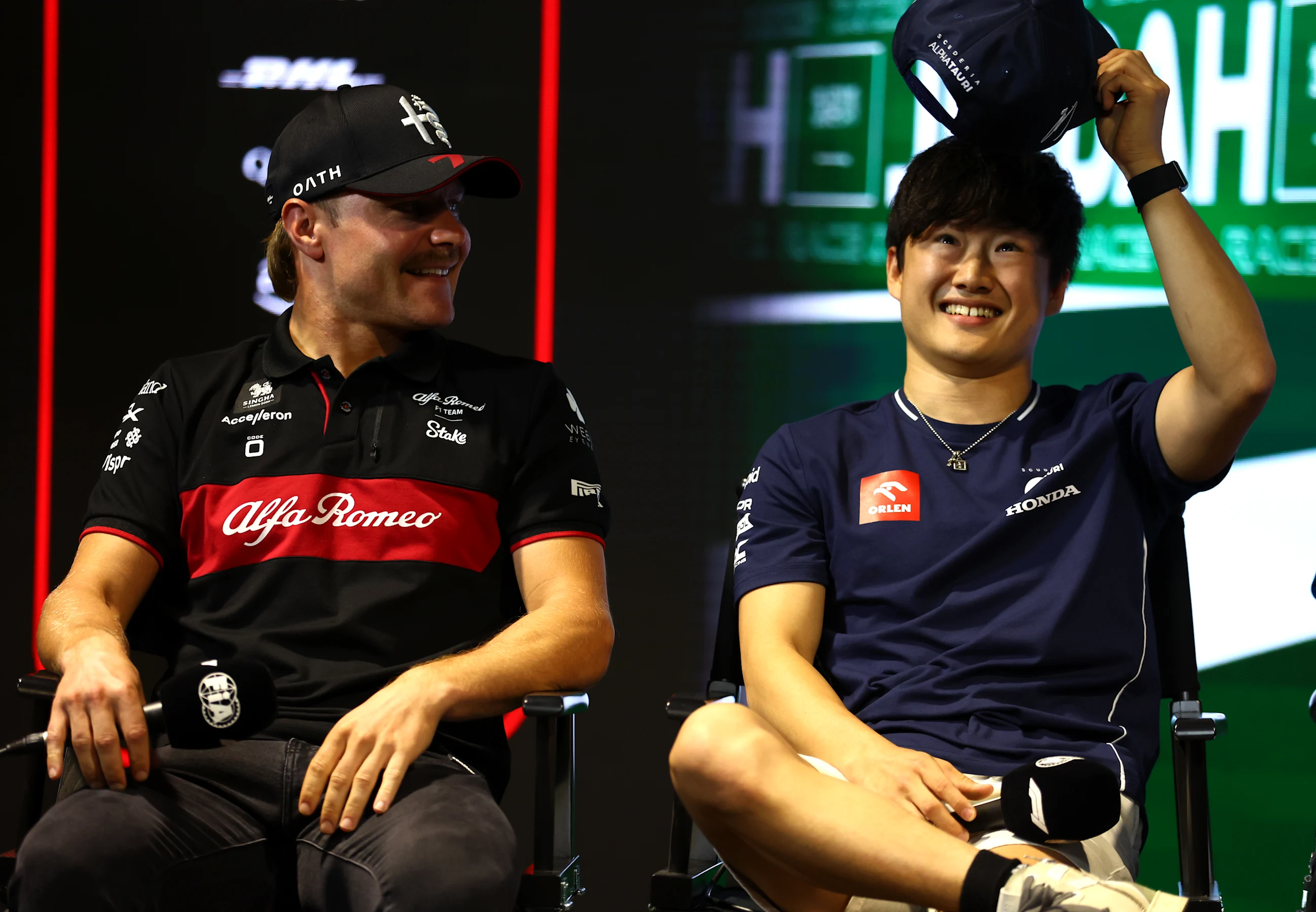 JEDDAH, SAUDI ARABIA - MARCH 16: Valtteri Bottas of Finland and Alfa Romeo F1 talks with Yuki
