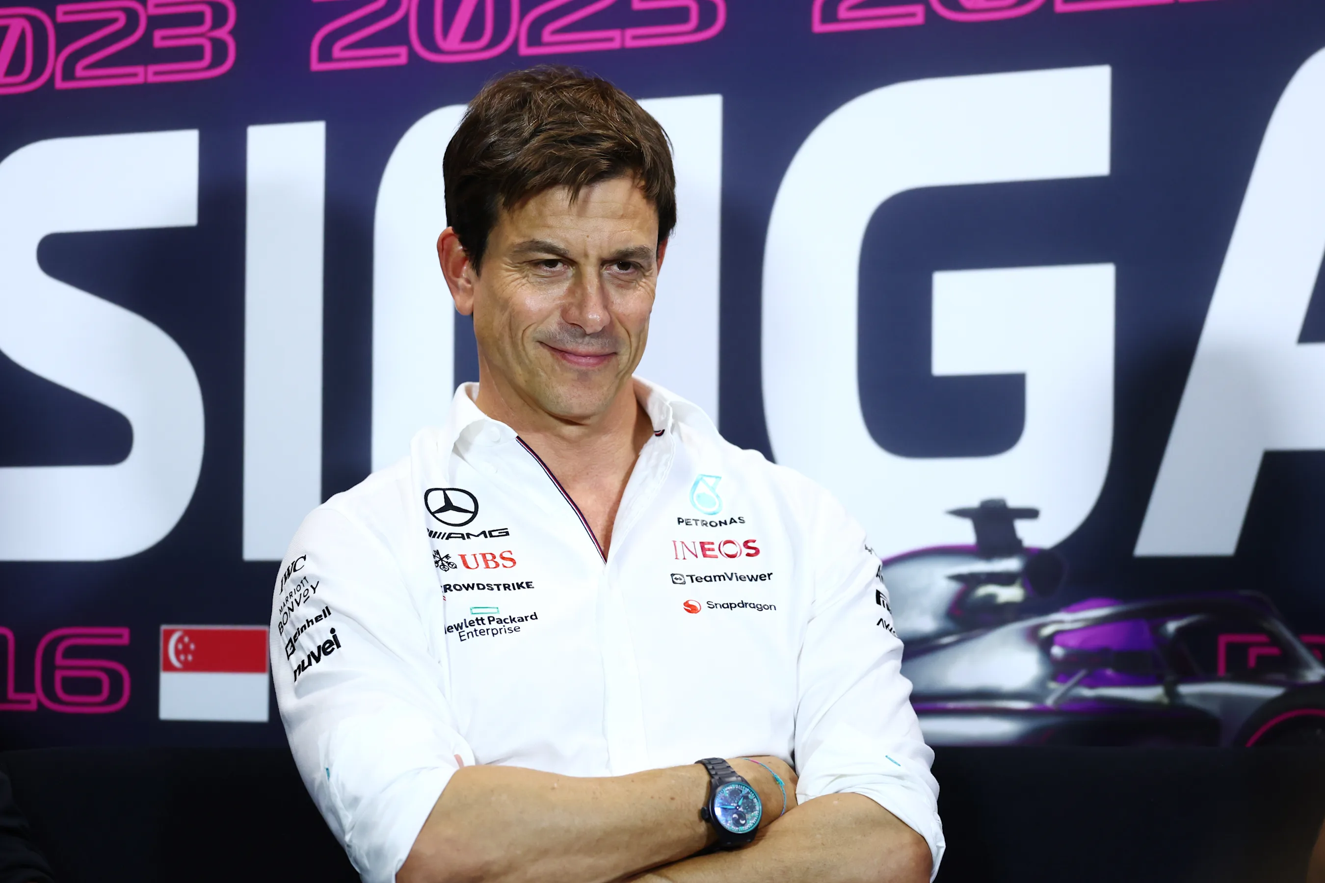 SINGAPORE, SINGAPORE - SEPTEMBER 15: Mercedes GP Executive Director Toto Wolff talks in a team