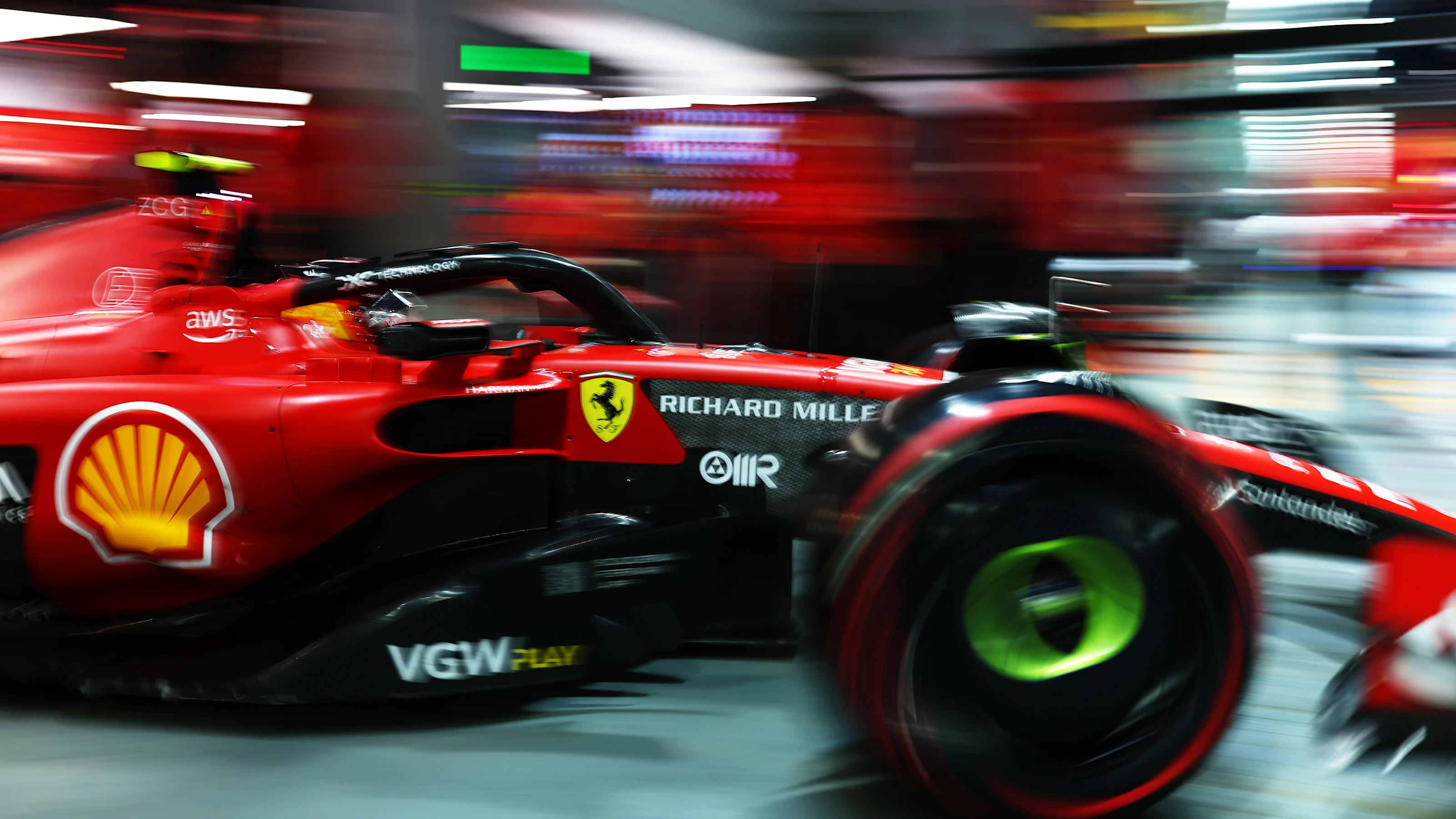 SINGAPORE, SINGAPORE - SEPTEMBER 15: Carlos Sainz of Spain driving (55) the Ferrari SF-23 leaves