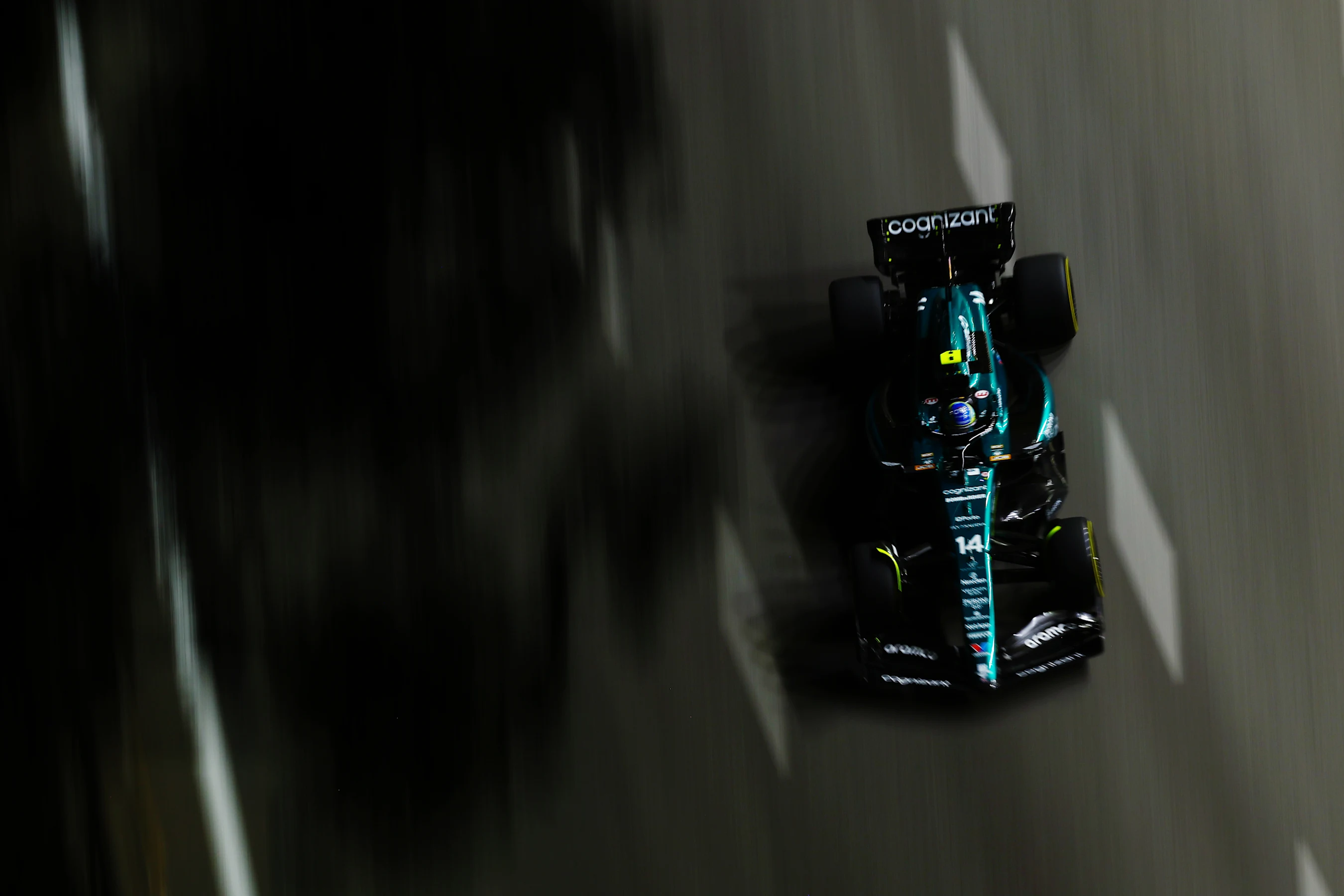 SINGAPORE, SINGAPORE - SEPTEMBER 15: Fernando Alonso of Spain driving the (14) Aston Martin AMR23