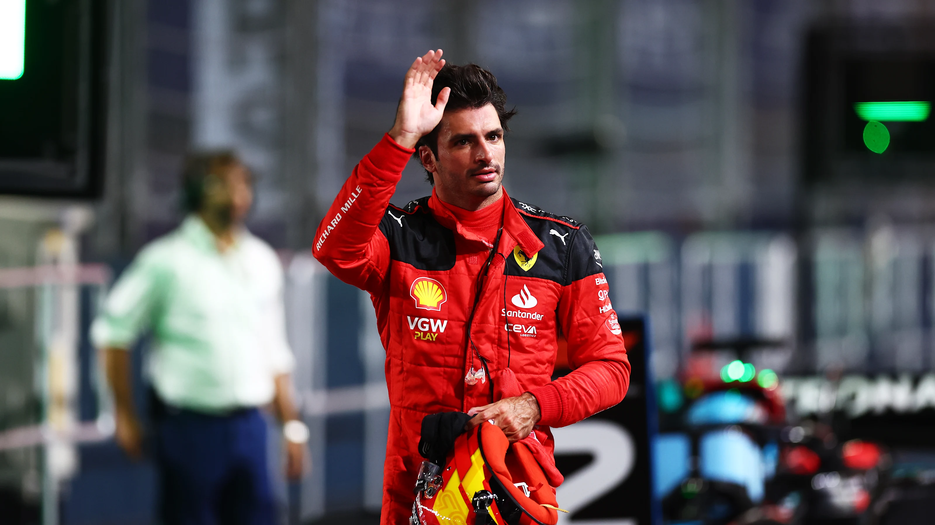 SINGAPORE, SINGAPORE - SEPTEMBER 16: Pole position qualifier Carlos Sainz of Spain and Ferrari