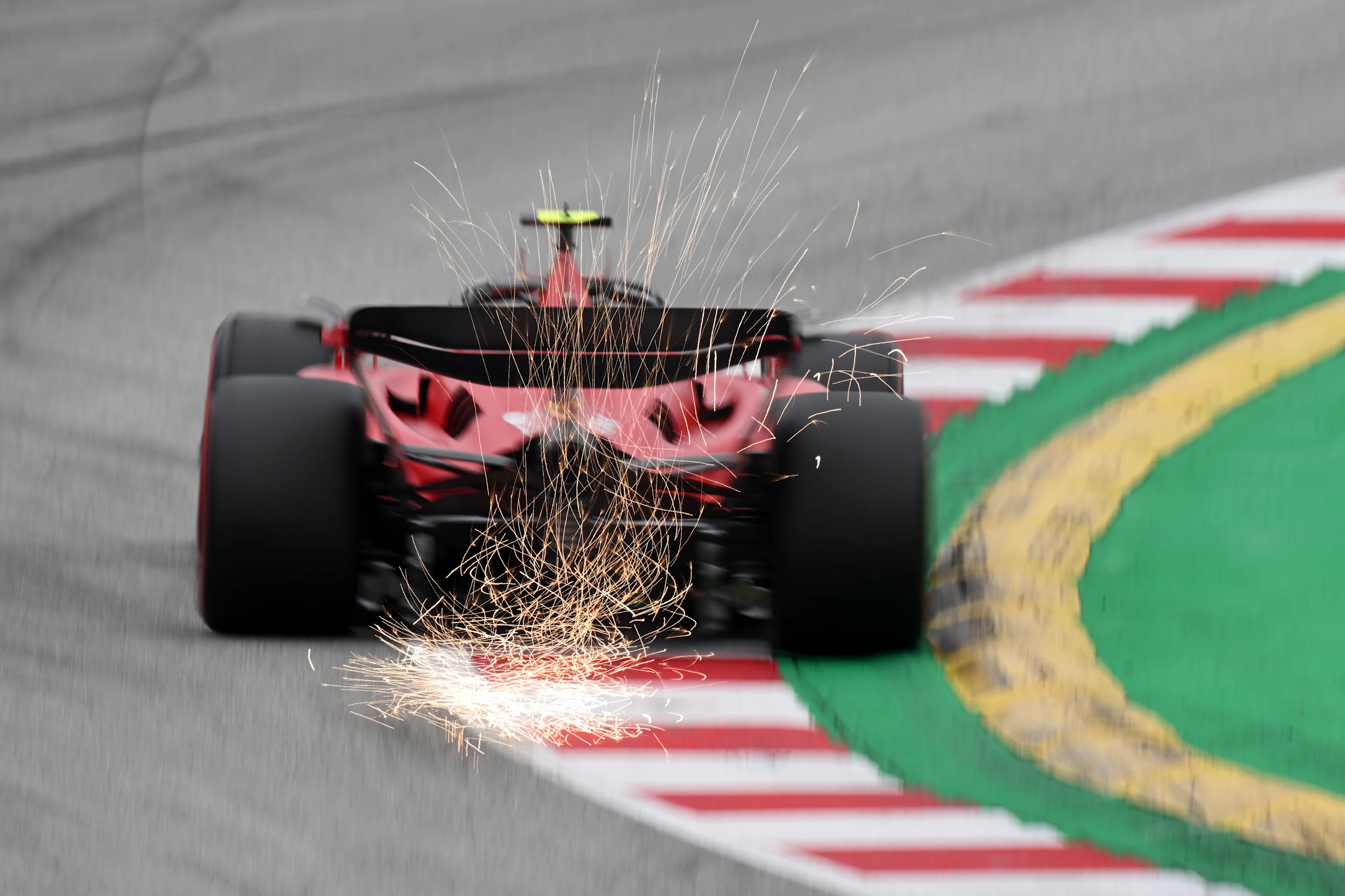 BARCELONA, SPAIN - JUNE 03: Sparks fly behind Carlos Sainz of Spain driving (55) the Ferrari SF-23