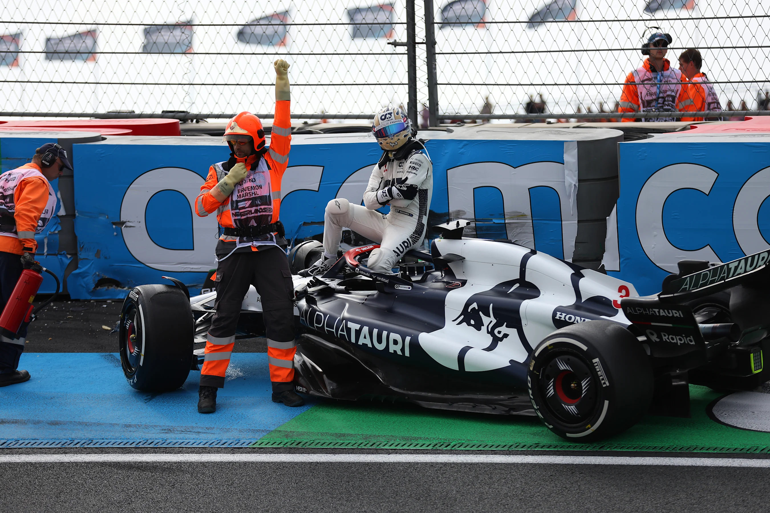 ZANDVOORT, NETHERLANDS - AUGUST 25: Daniel Ricciardo of Australia and Scuderia AlphaTauri walks