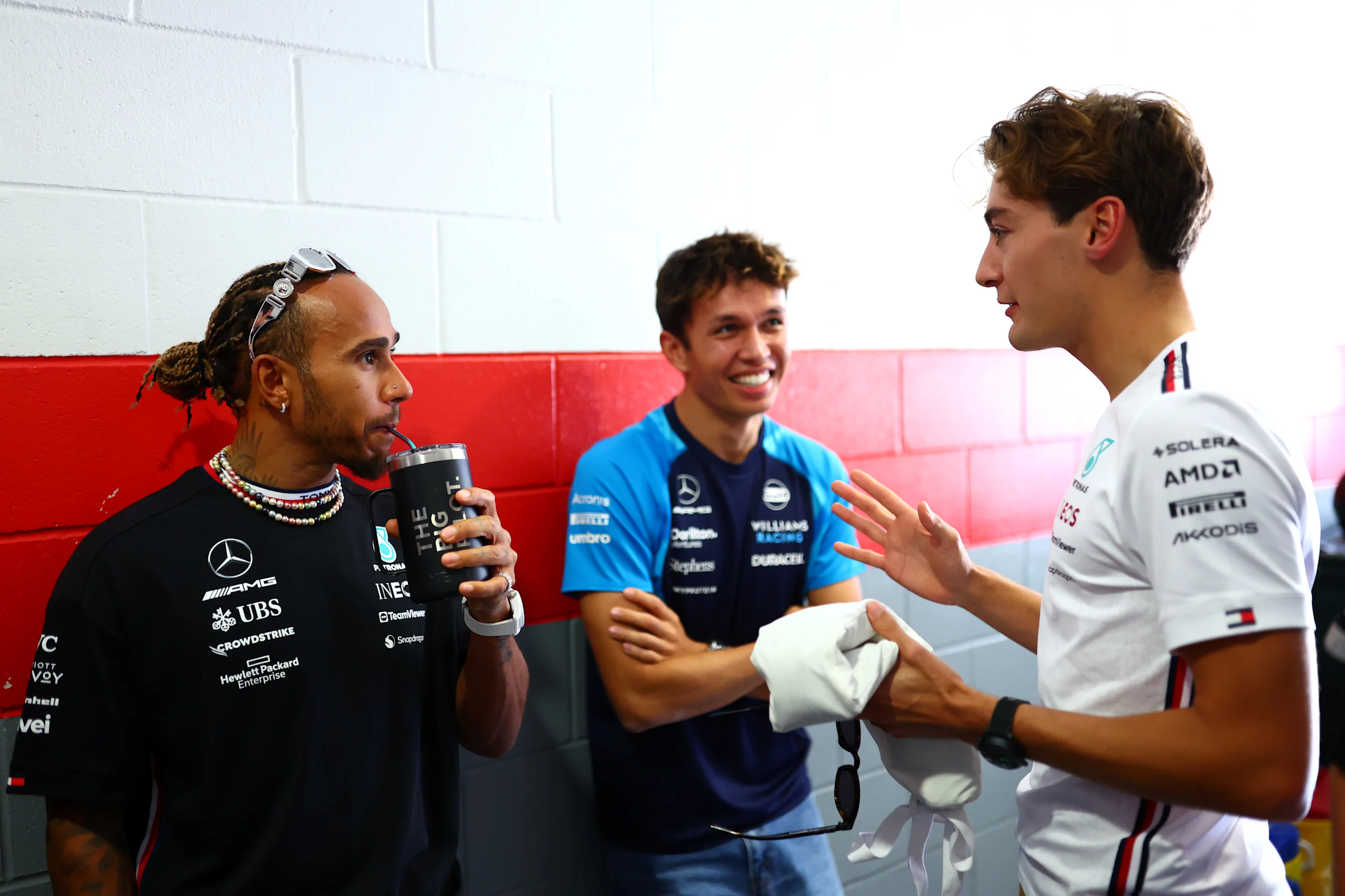 AUSTIN, TEXAS - OCTOBER 22: Lewis Hamilton of Great Britain and Mercedes speaks to George Russell