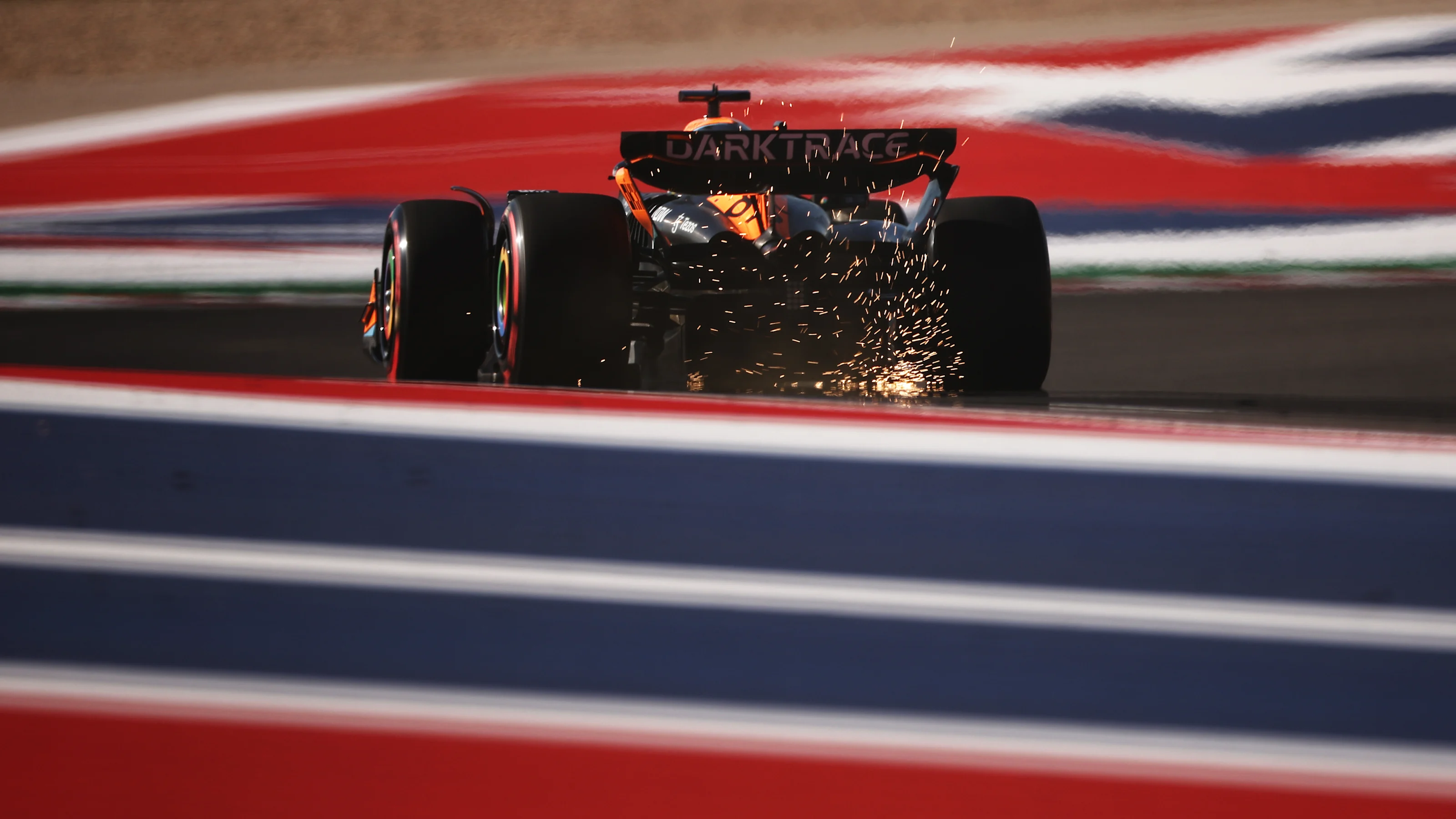 AUSTIN, TEXAS - OCTOBER 20: Sparks fly behind Oscar Piastri of Australia driving the (81) McLaren