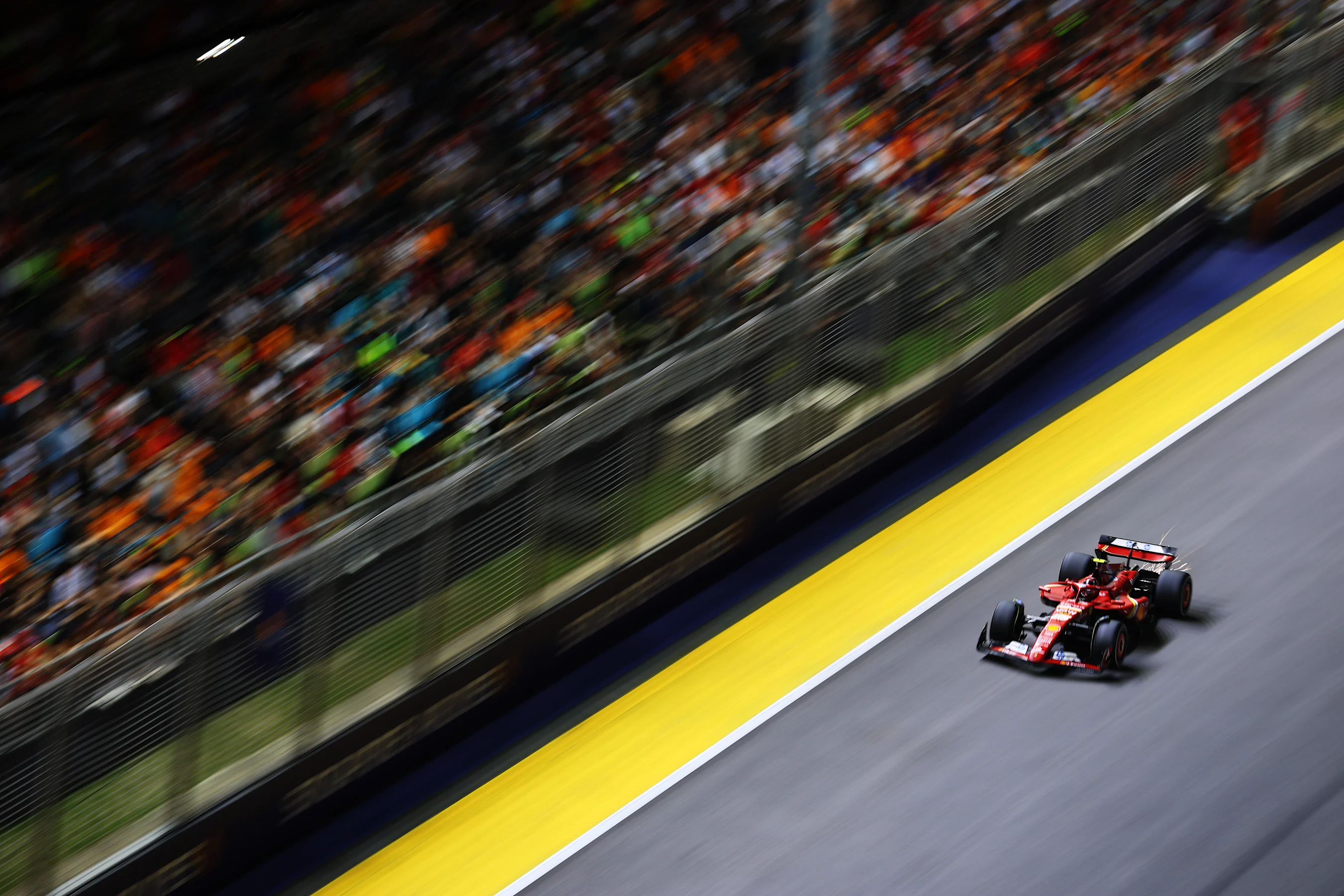 SINGAPORE, SINGAPORE - SEPTEMBER 22: Carlos Sainz of Spain driving (55) the Ferrari SF-24 on track