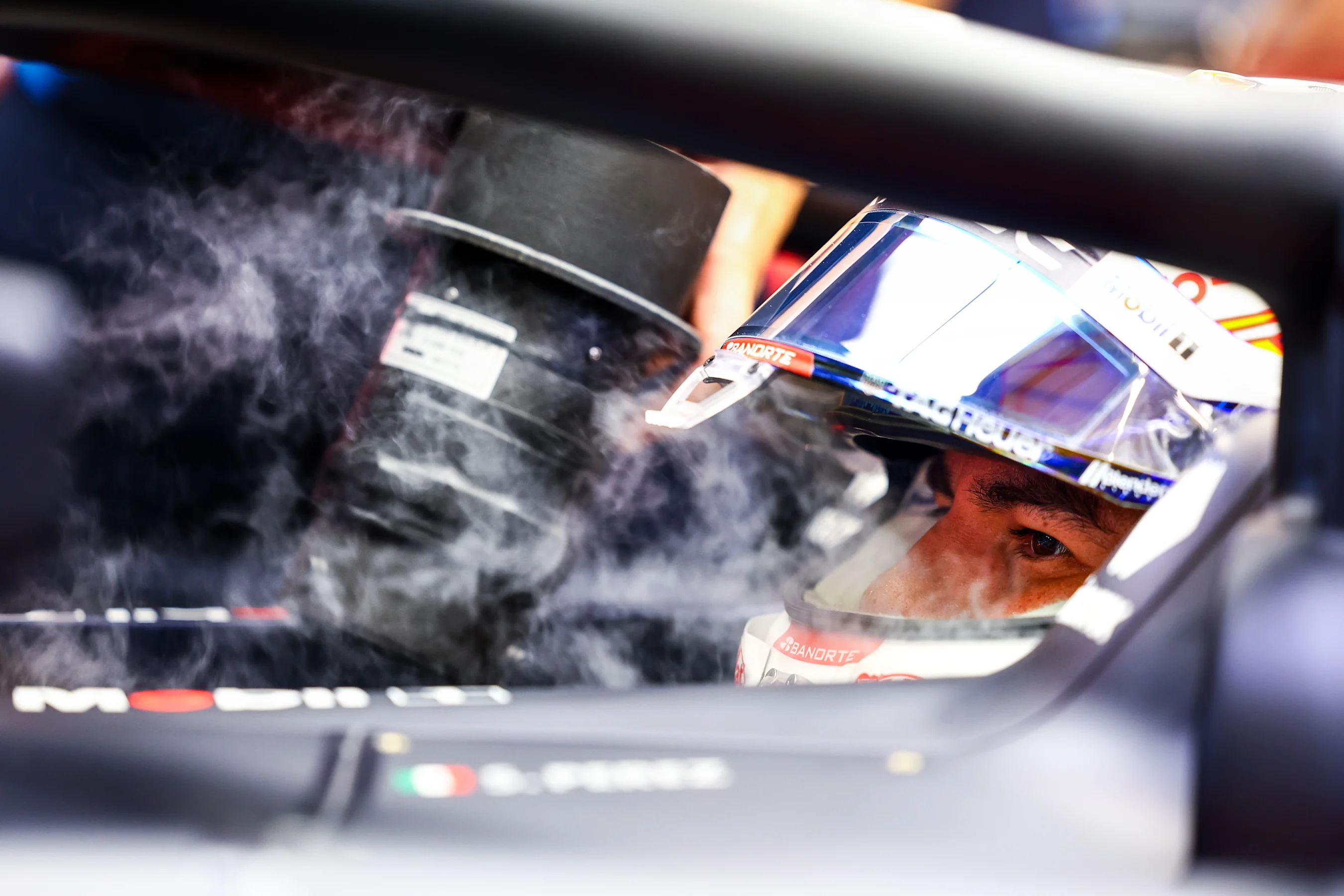 SINGAPORE, SINGAPORE - SEPTEMBER 20: Sergio Perez of Mexico driving the (11) Oracle Red Bull Racing