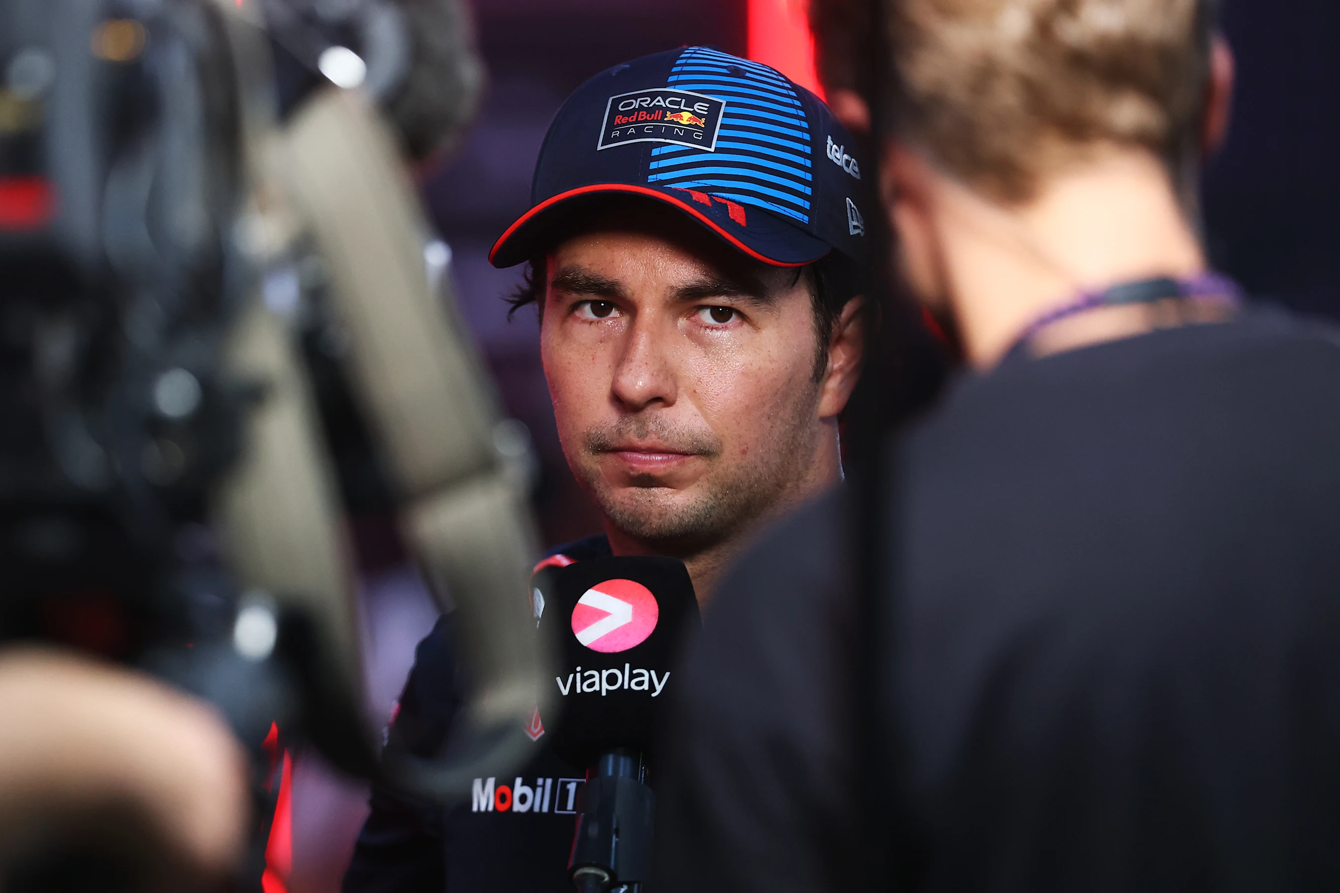 SINGAPORE, SINGAPORE - SEPTEMBER 21: 13th placed qualifier Sergio Perez of Mexico and Oracle Red