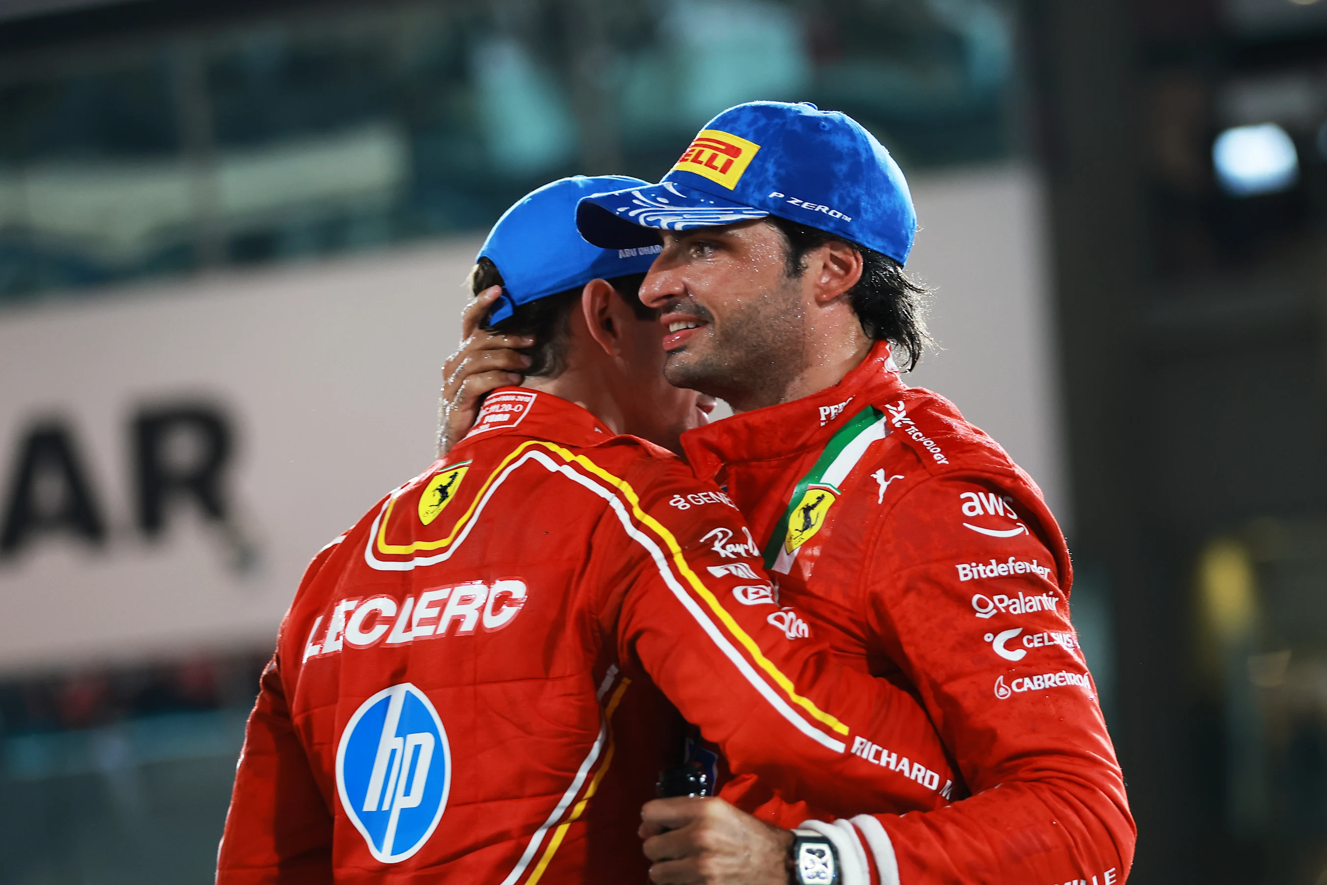 ABU DHABI, UNITED ARAB EMIRATES - DECEMBER 08: Second placed Carlos Sainz of Spain and Ferrari and