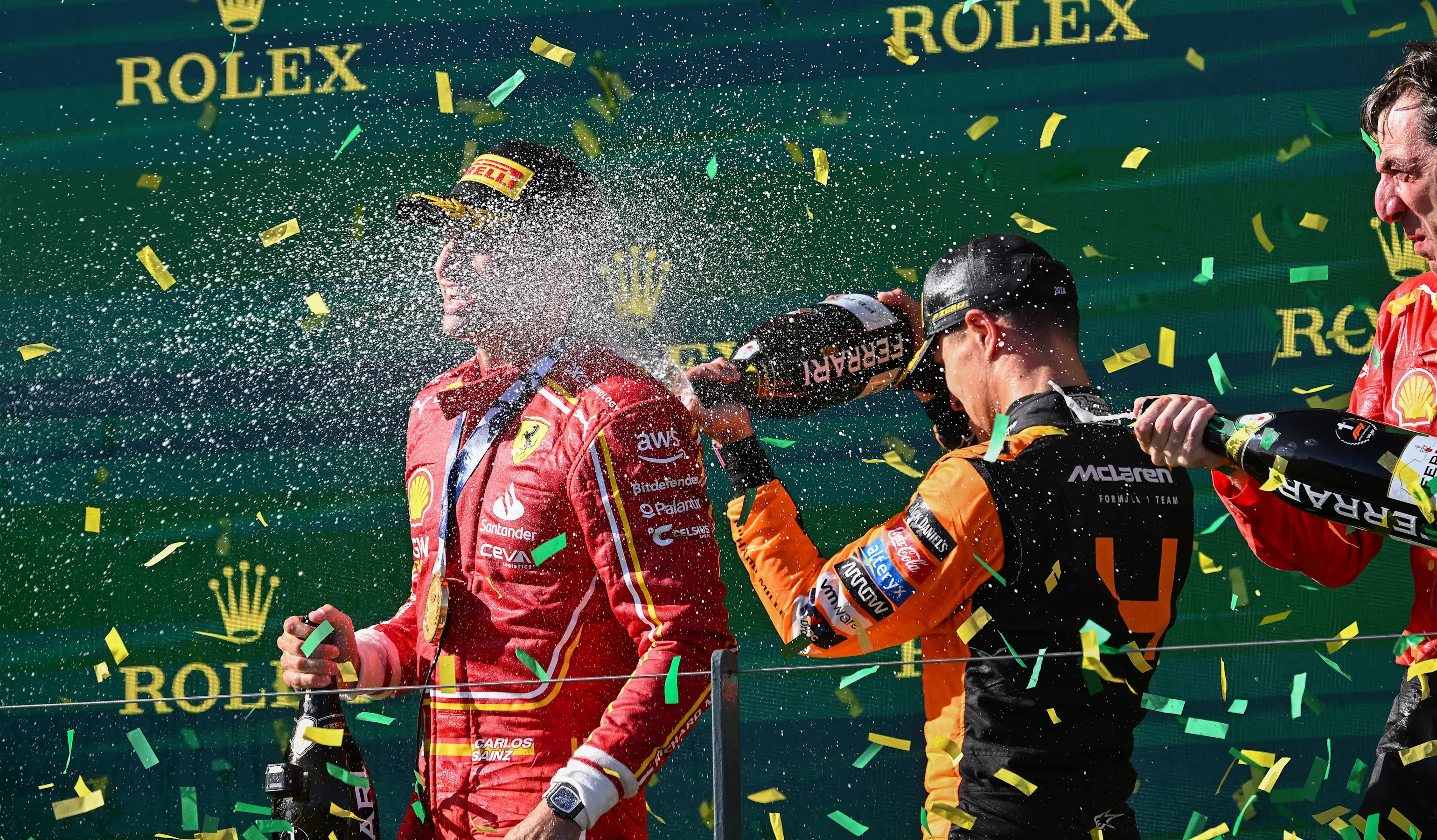 MELBOURNE, AUSTRALIA - MARCH 24: Race winner Carlos Sainz of Spain and Third placed Lando Norris of