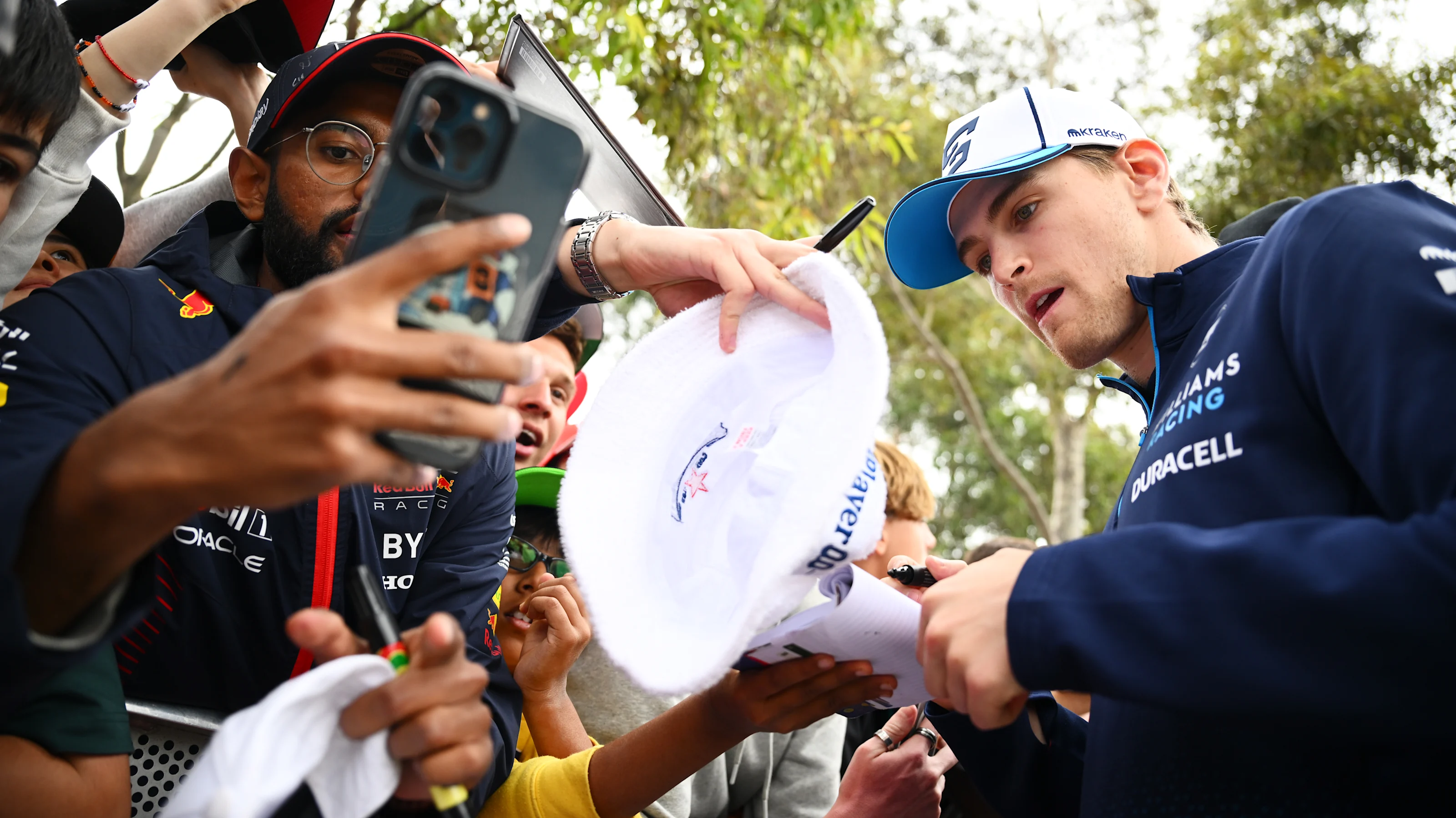 MELBOURNE, AUSTRALIA - MARCH 24: Logan Sargeant of United States and Williams greets fans on the
