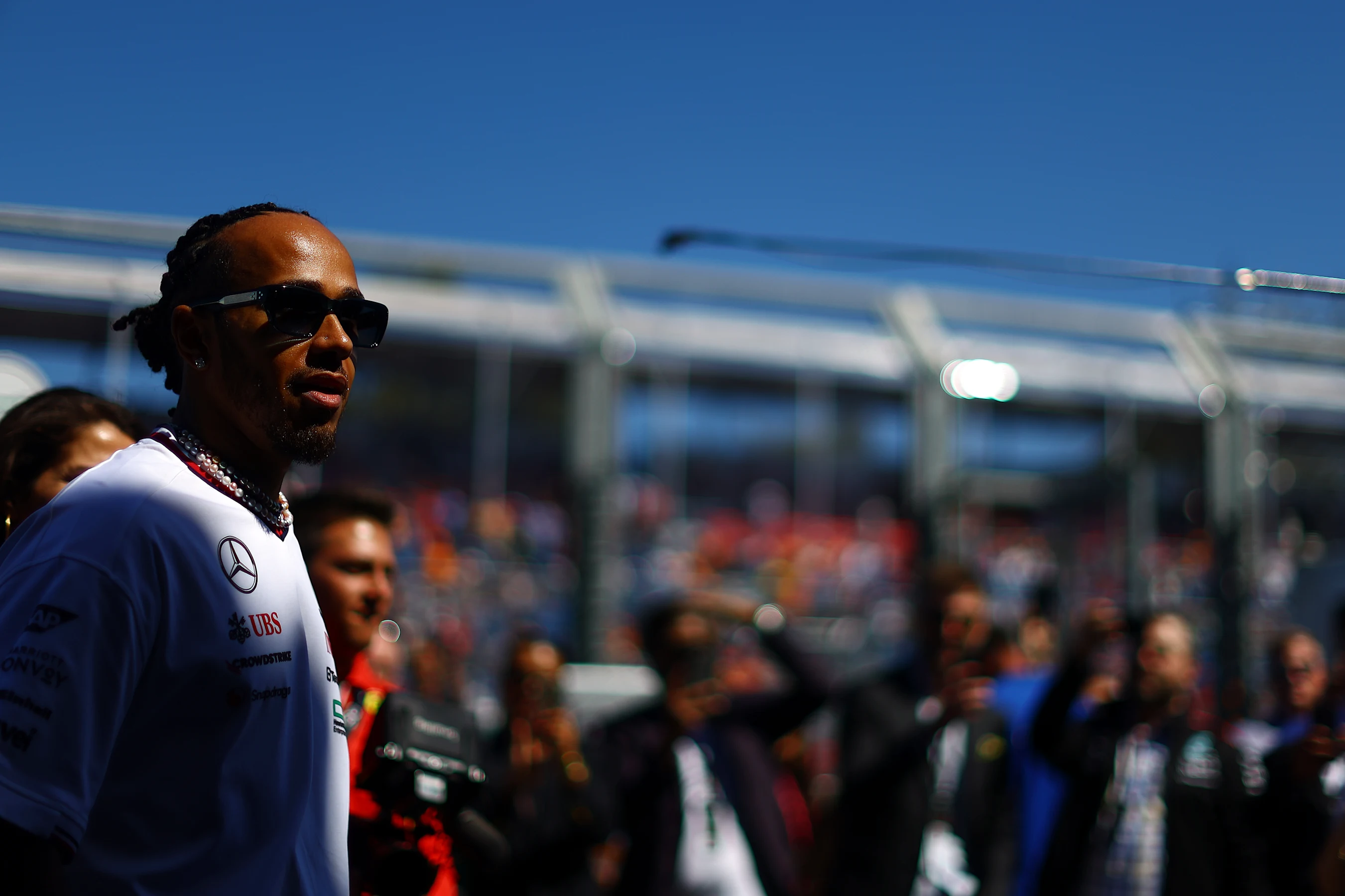 MELBOURNE, AUSTRALIA - MARCH 24: Lewis Hamilton of Great Britain and Mercedes looks on from the