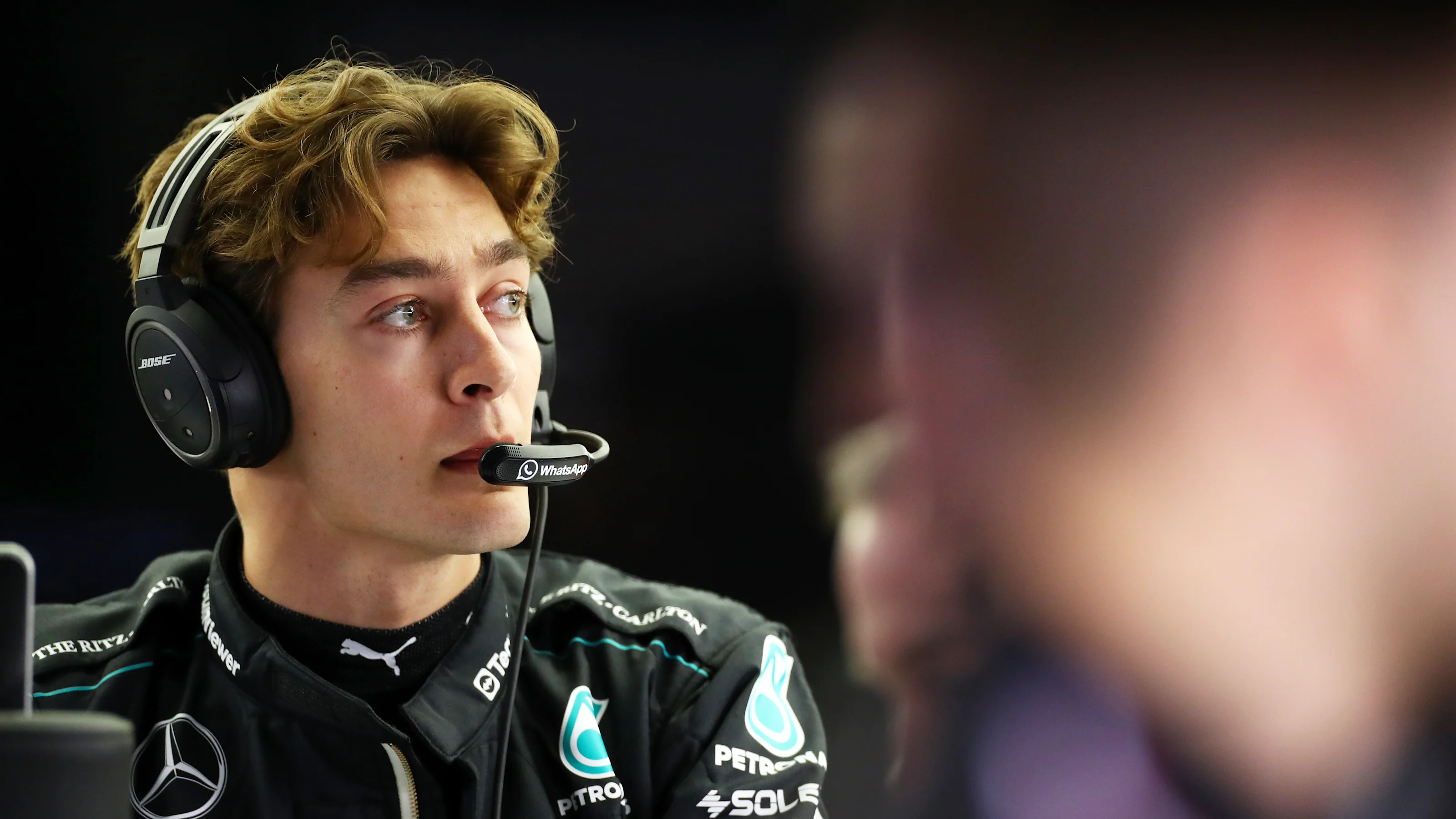 BAHRAIN, BAHRAIN - FEBRUARY 29: George Russell of Great Britain and Mercedes looks on in the garage