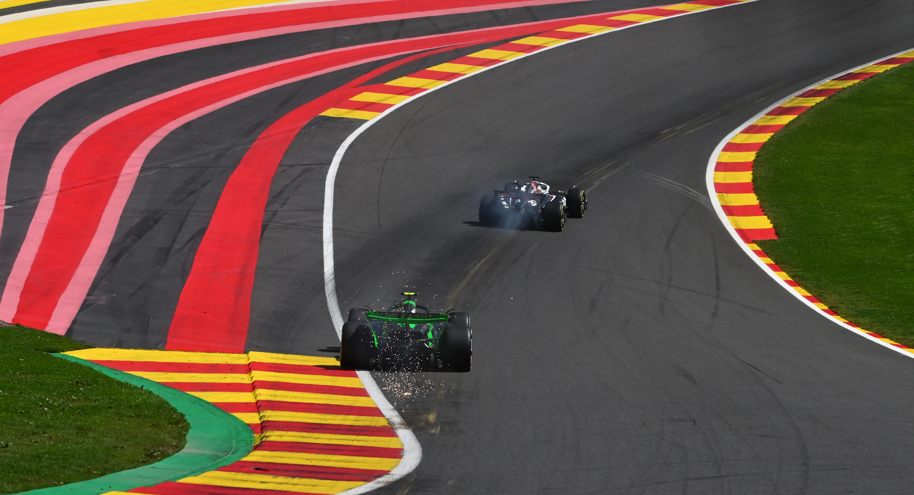 SPA, BELGIUM - JULY 28: Sparks fly behind Zhou Guanyu of China driving the (24) Kick Sauber C44