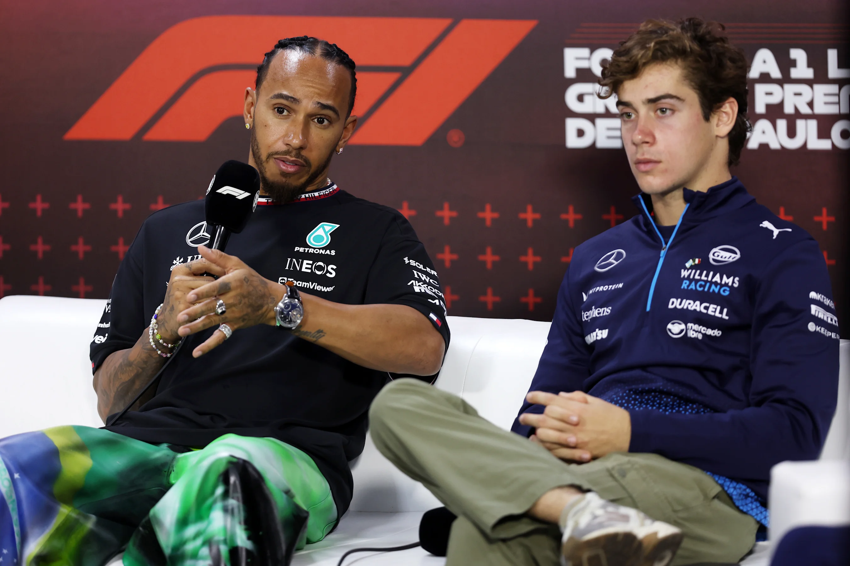 SAO PAULO, BRAZIL - OCTOBER 31: Lewis Hamilton of Great Britain and Mercedes and Franco Colapinto