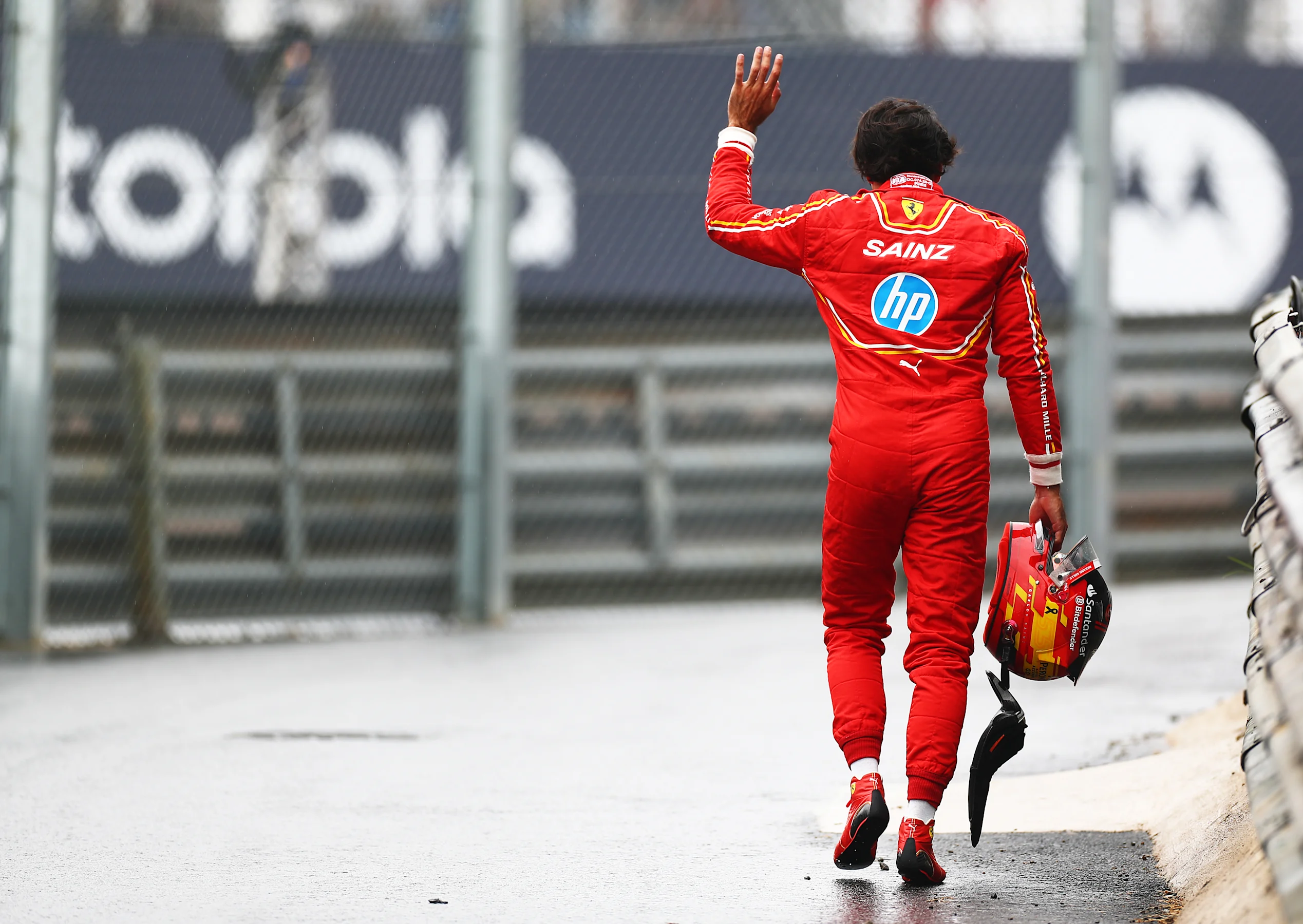 SAO PAULO, BRAZIL - NOVEMBER 03: 14th placed qualifier Carlos Sainz of Spain and Ferrari waves to