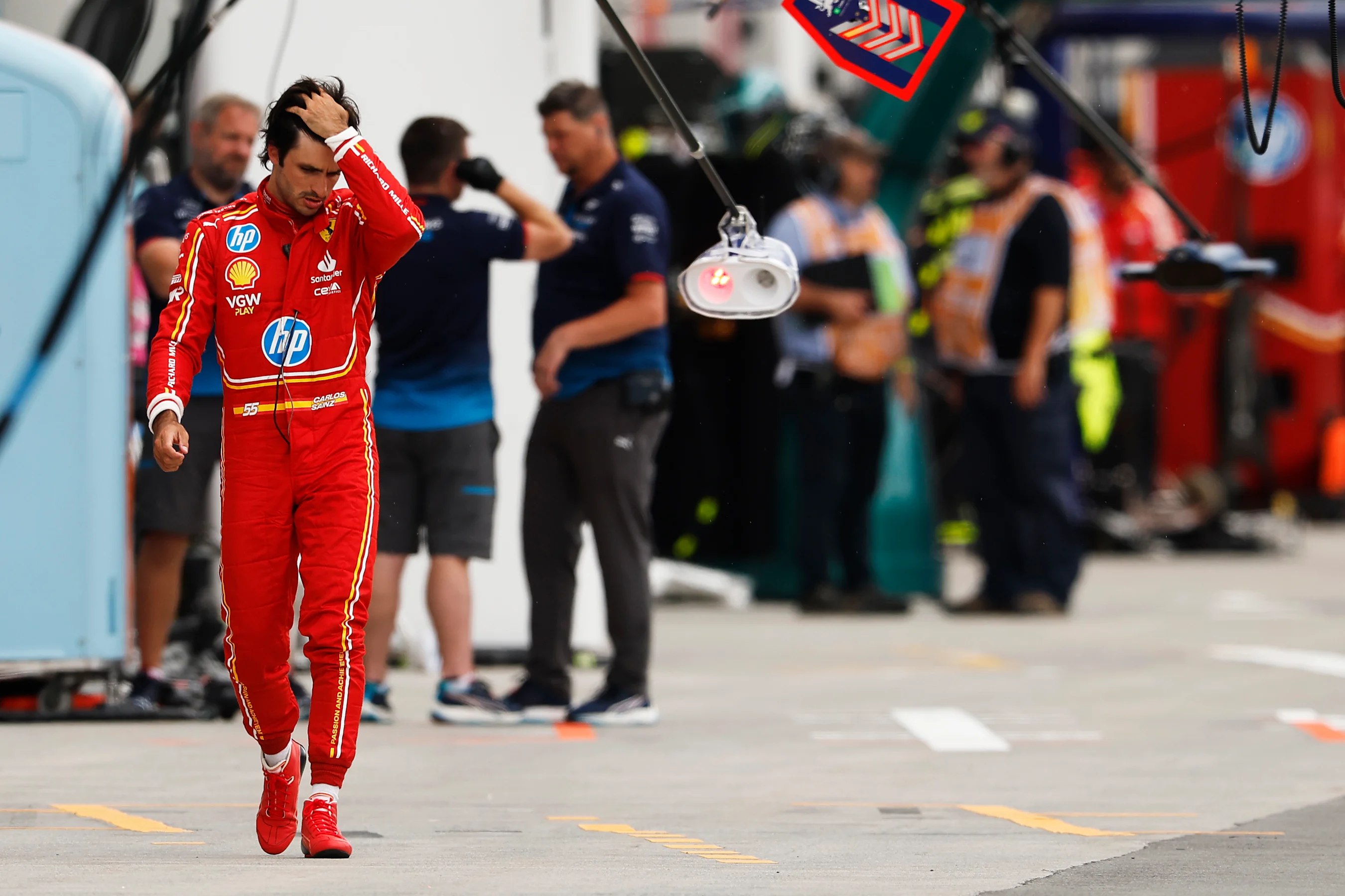MONTREAL, QUEBEC - JUNE 08: 12th placed qualifier Carlos Sainz of Spain and Ferrari walks in the