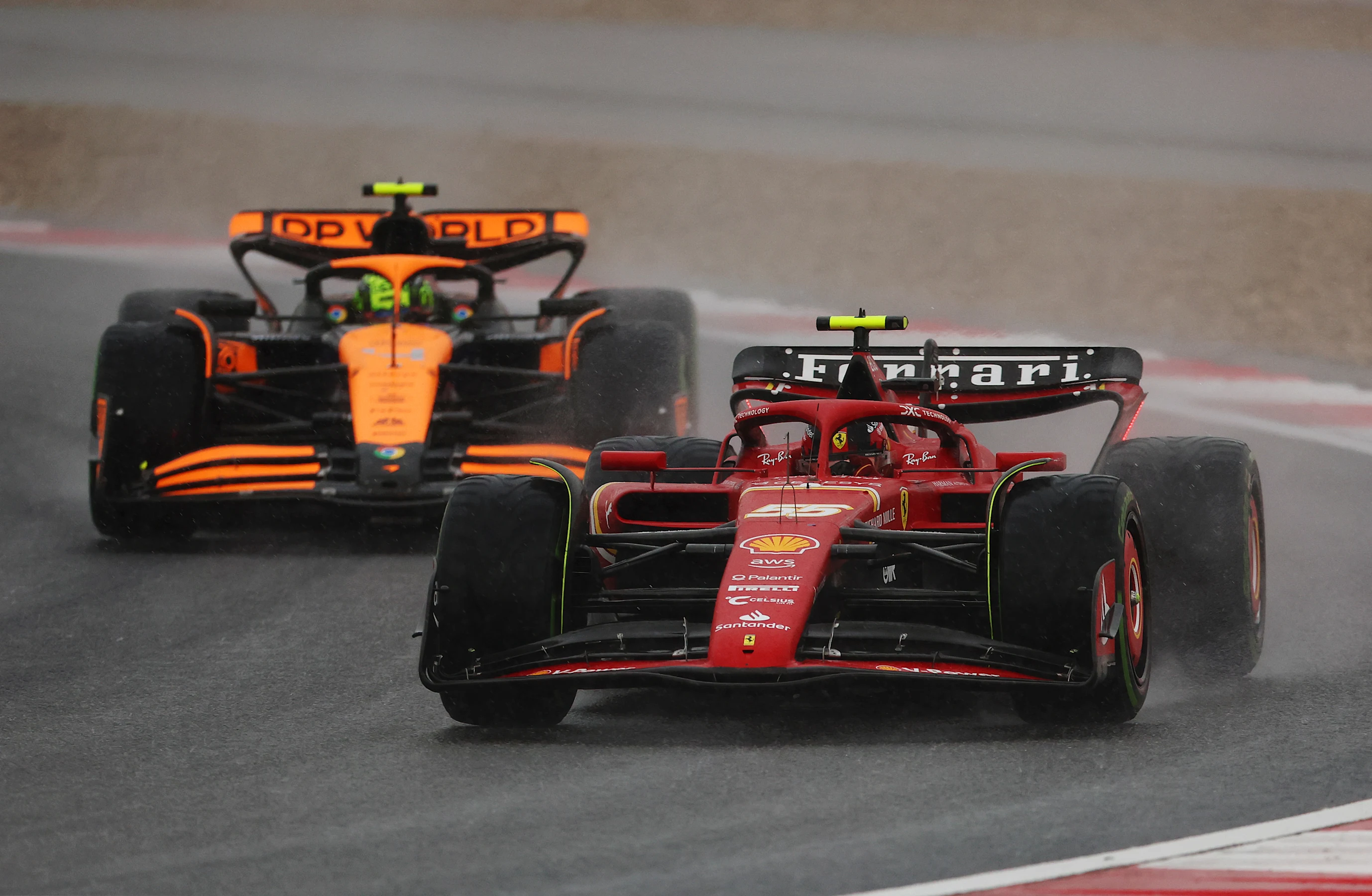HANGHAI, CHINA - APRIL 19: Carlos Sainz of Spain driving (55) the Ferrari SF-24 leads Lando Norris