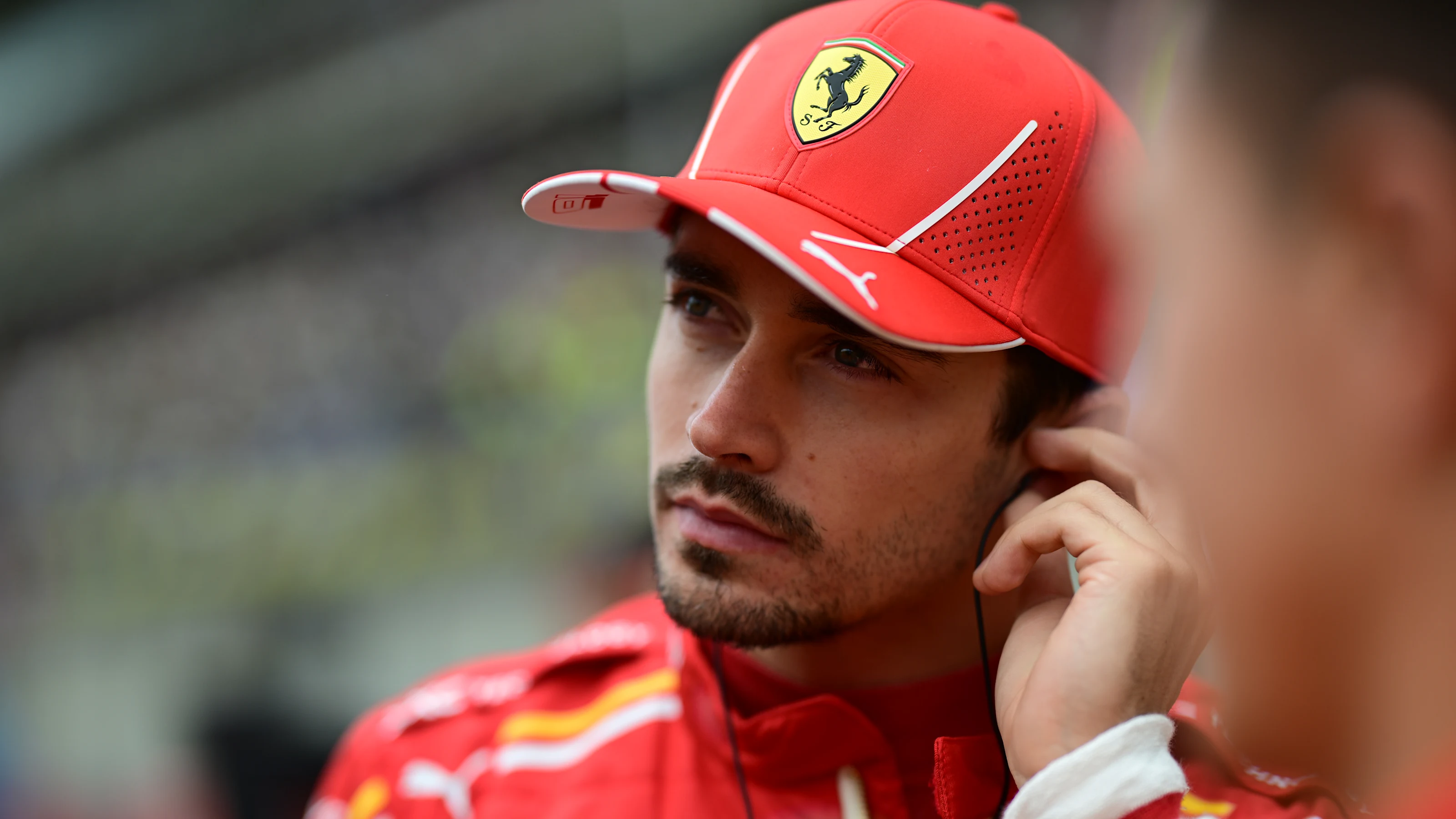 SHANGHAI, CHINA - APRIL 20: Charles Leclerc of Monaco and Ferrari looks on, on the grid prior to