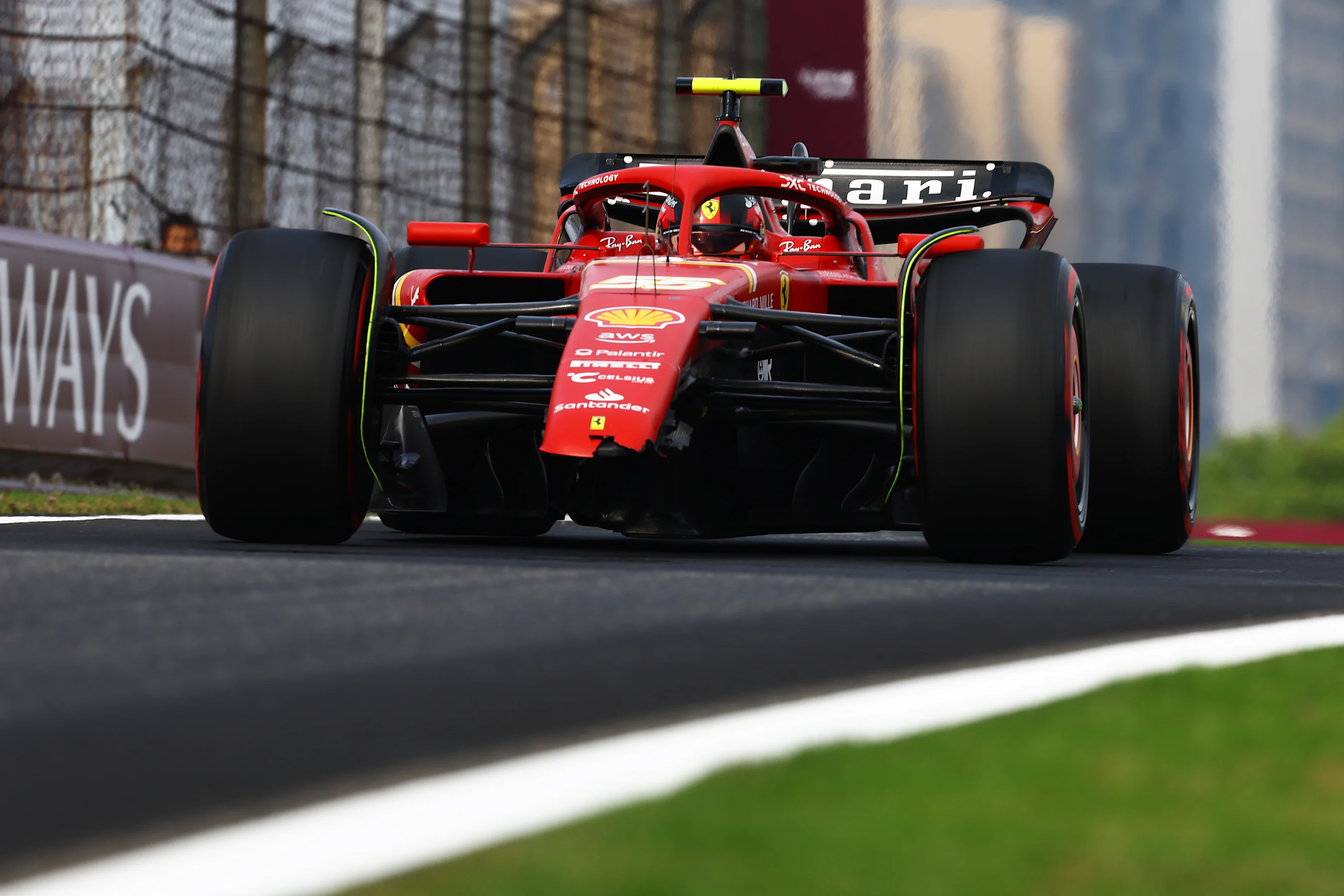 SHANGHAI, CHINA - APRIL 20: Carlos Sainz of Spain and Ferrari returns to the pitlane after crashing