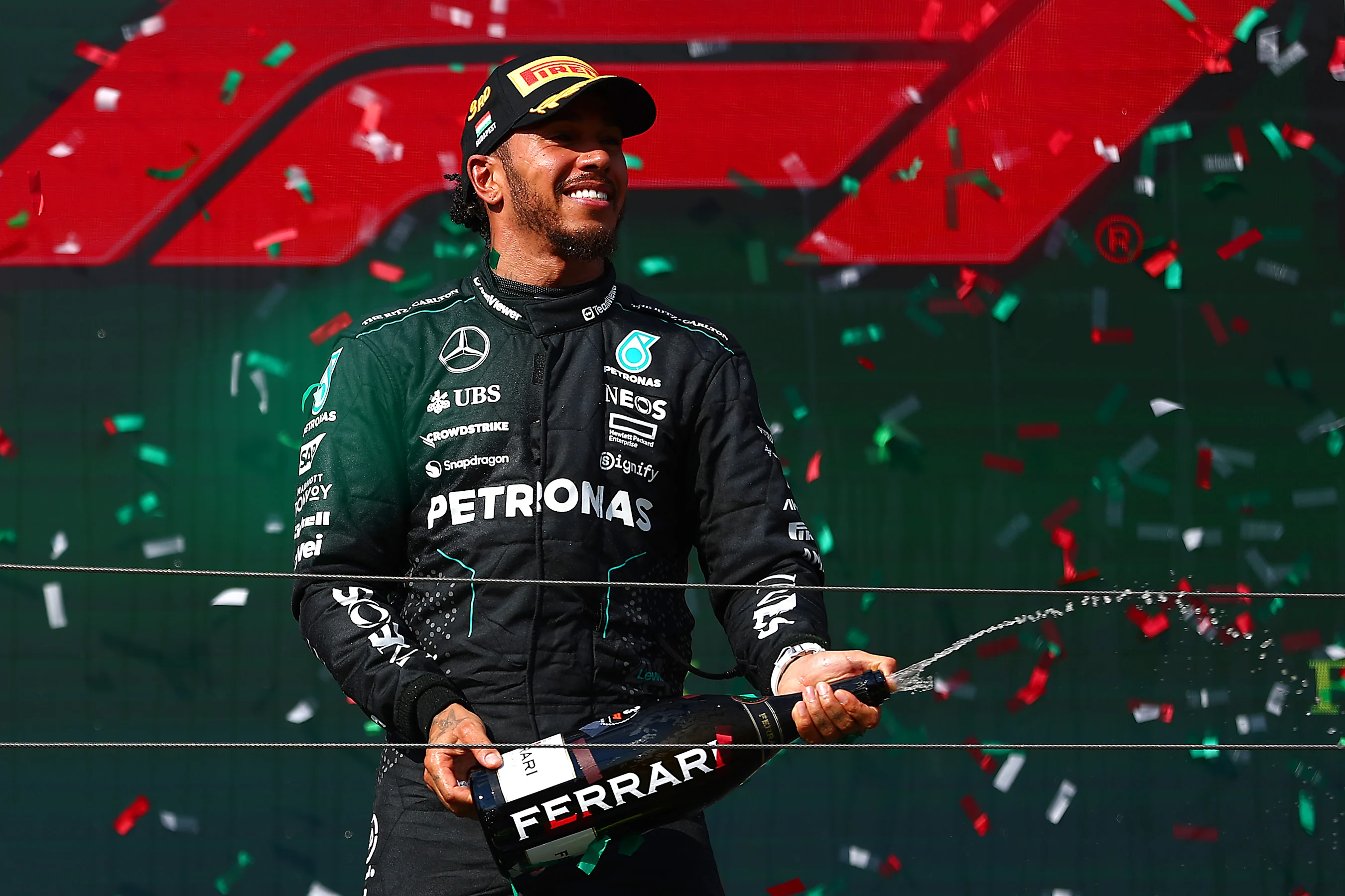BUDAPEST, HUNGARY - JULY 21: Third placed Lewis Hamilton of Great Britain and Mercedes celebrates