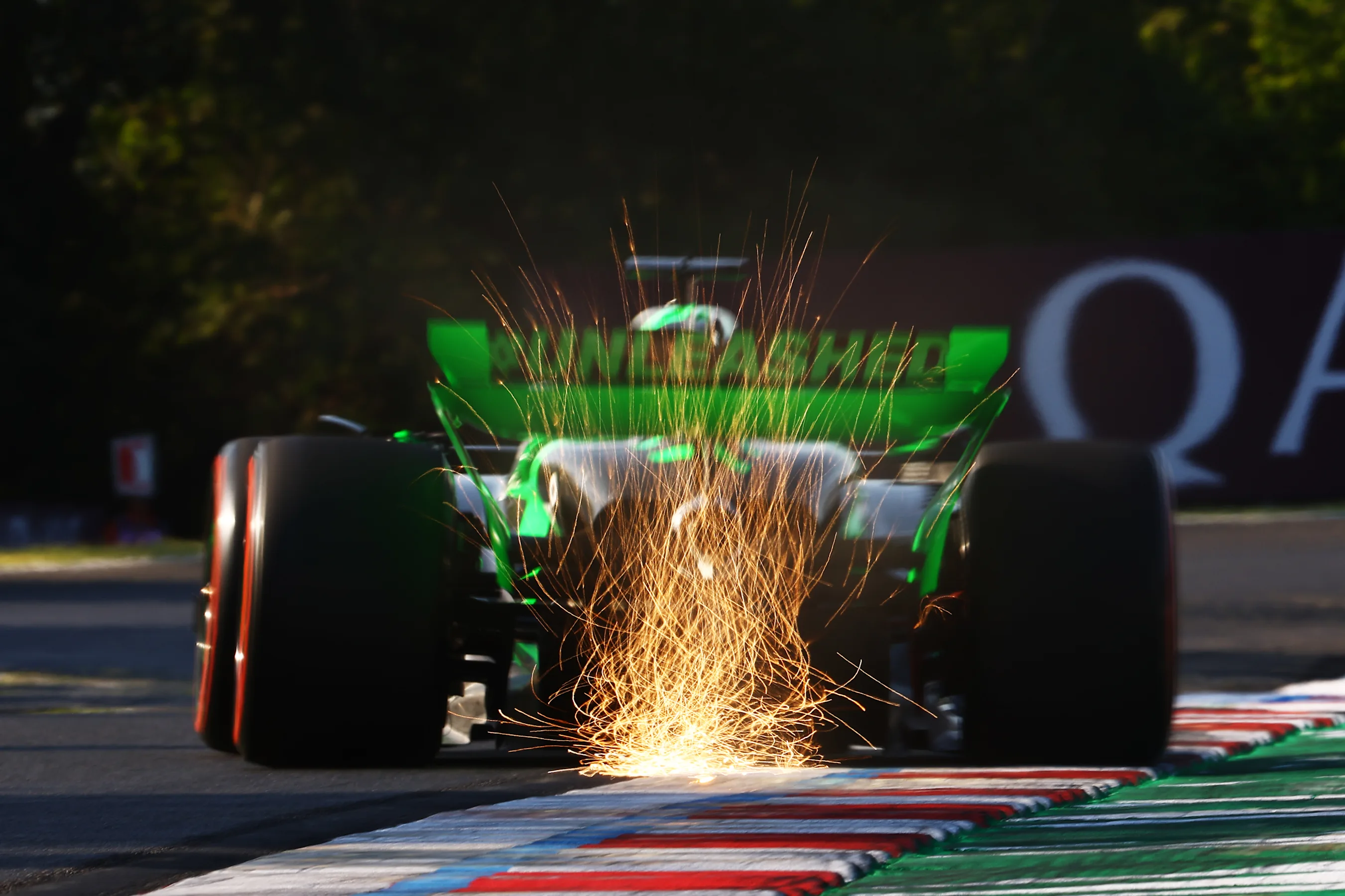 BUDAPEST, HUNGARY - JULY 19: Sparks fly behind Valtteri Bottas of Finland driving the (77) Kick