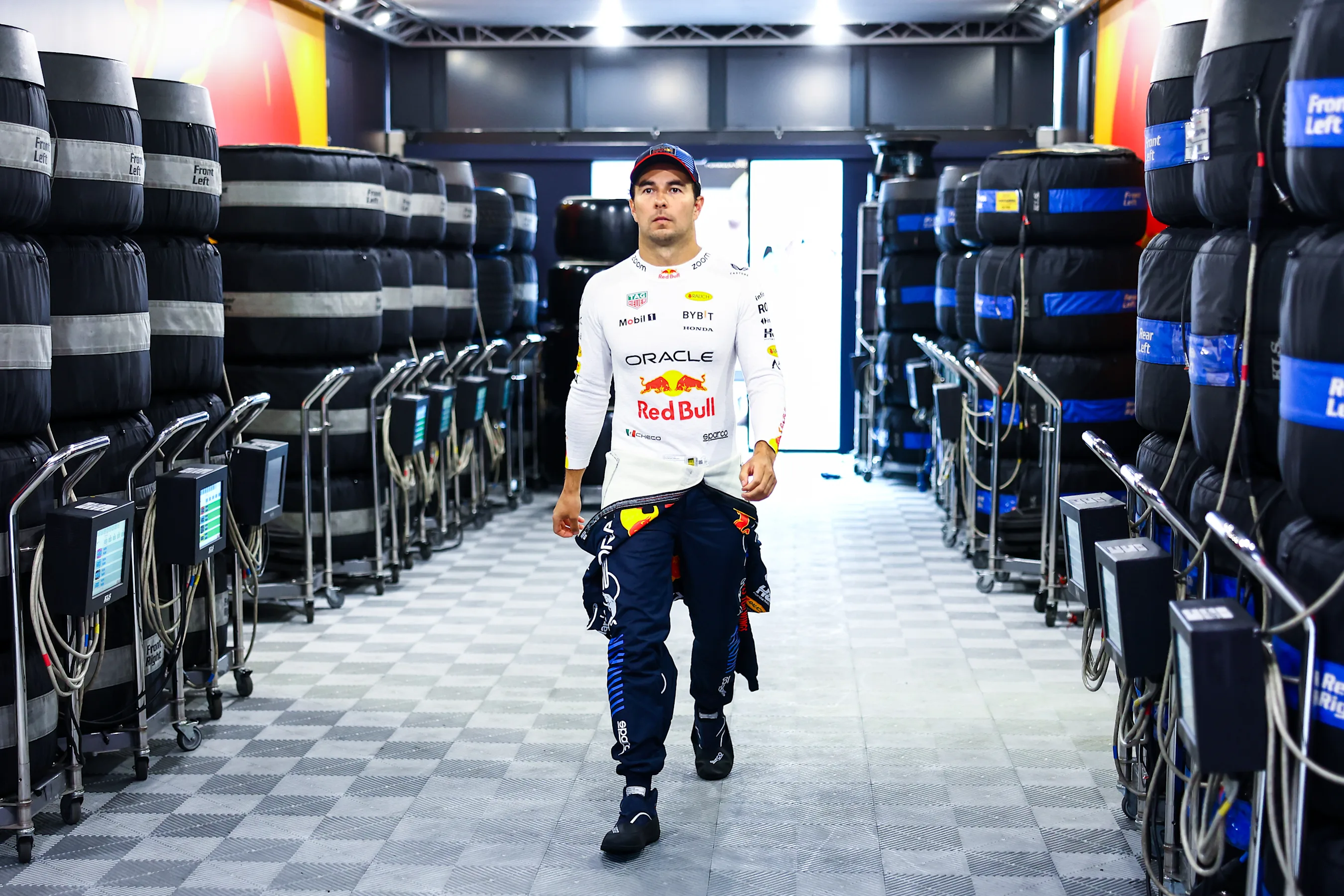 BUDAPEST, HUNGARY - JULY 20: Sergio Perez of Mexico and Oracle Red Bull Racing walks into the