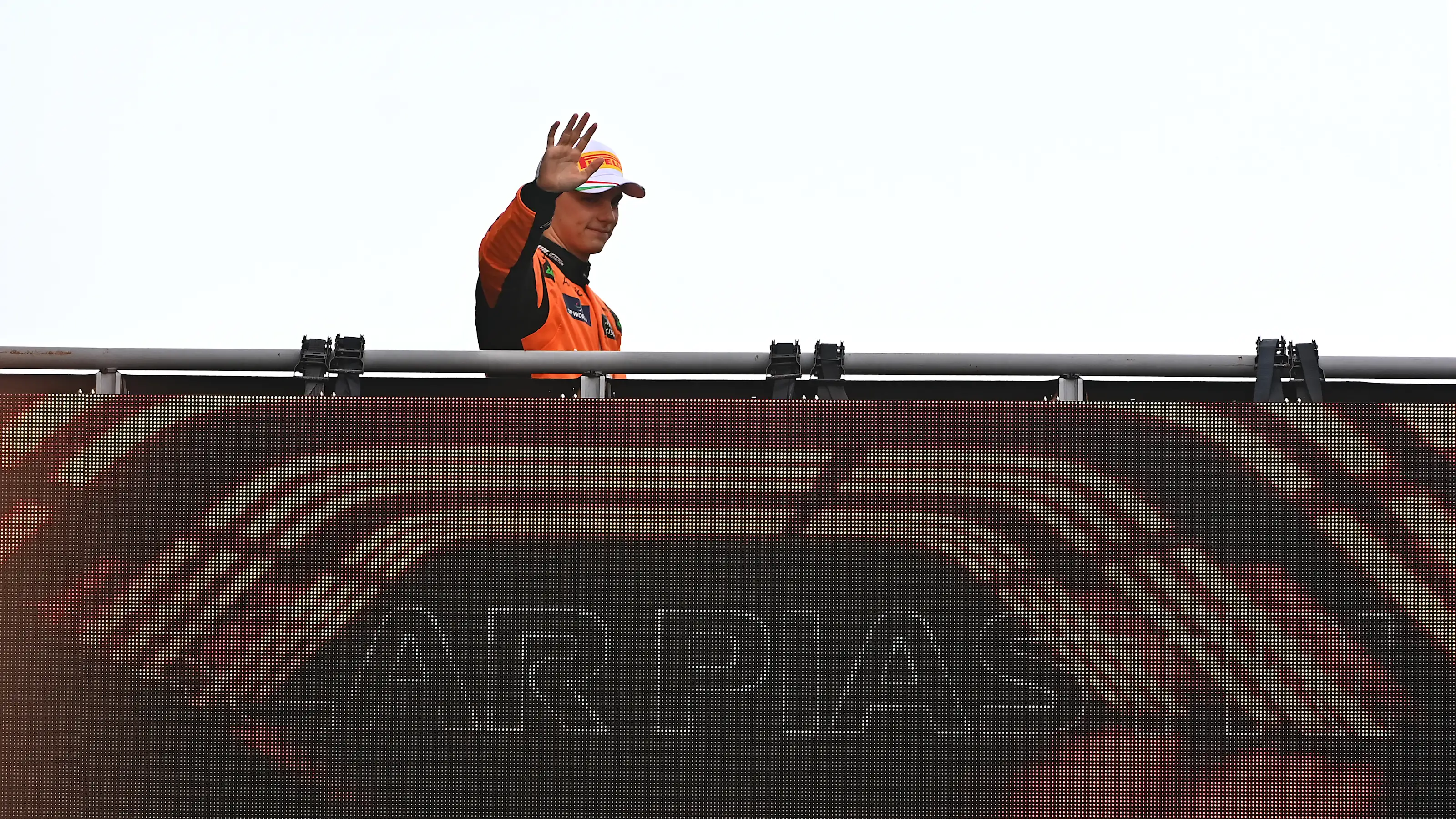 MONZA, ITALY - SEPTEMBER 01: Oscar Piastri of Australia and McLaren waves to fans as he walks to