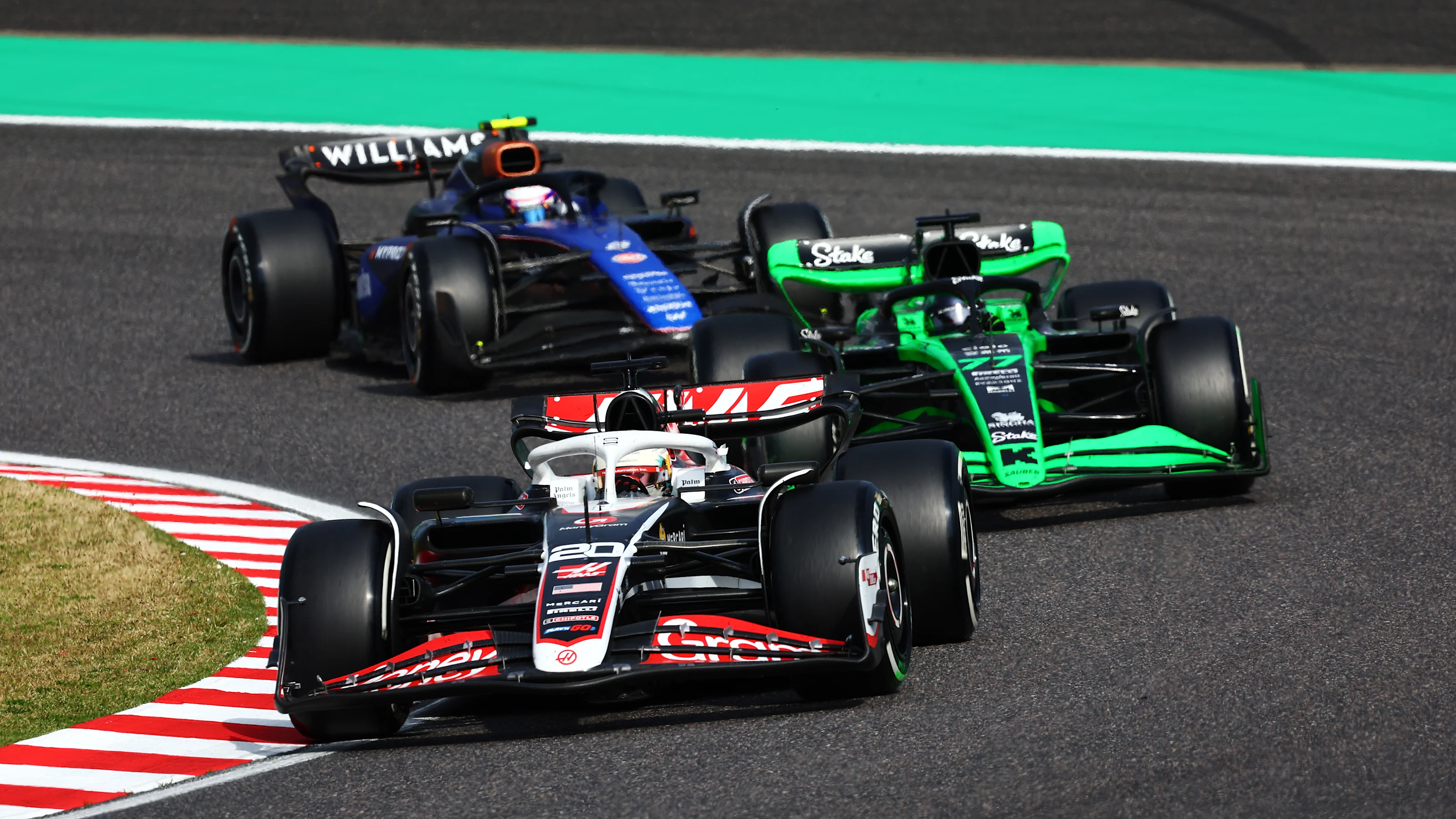SUZUKA, JAPAN - APRIL 07: Kevin Magnussen of Denmark driving the (20) Haas F1 VF-24 Ferrari leads