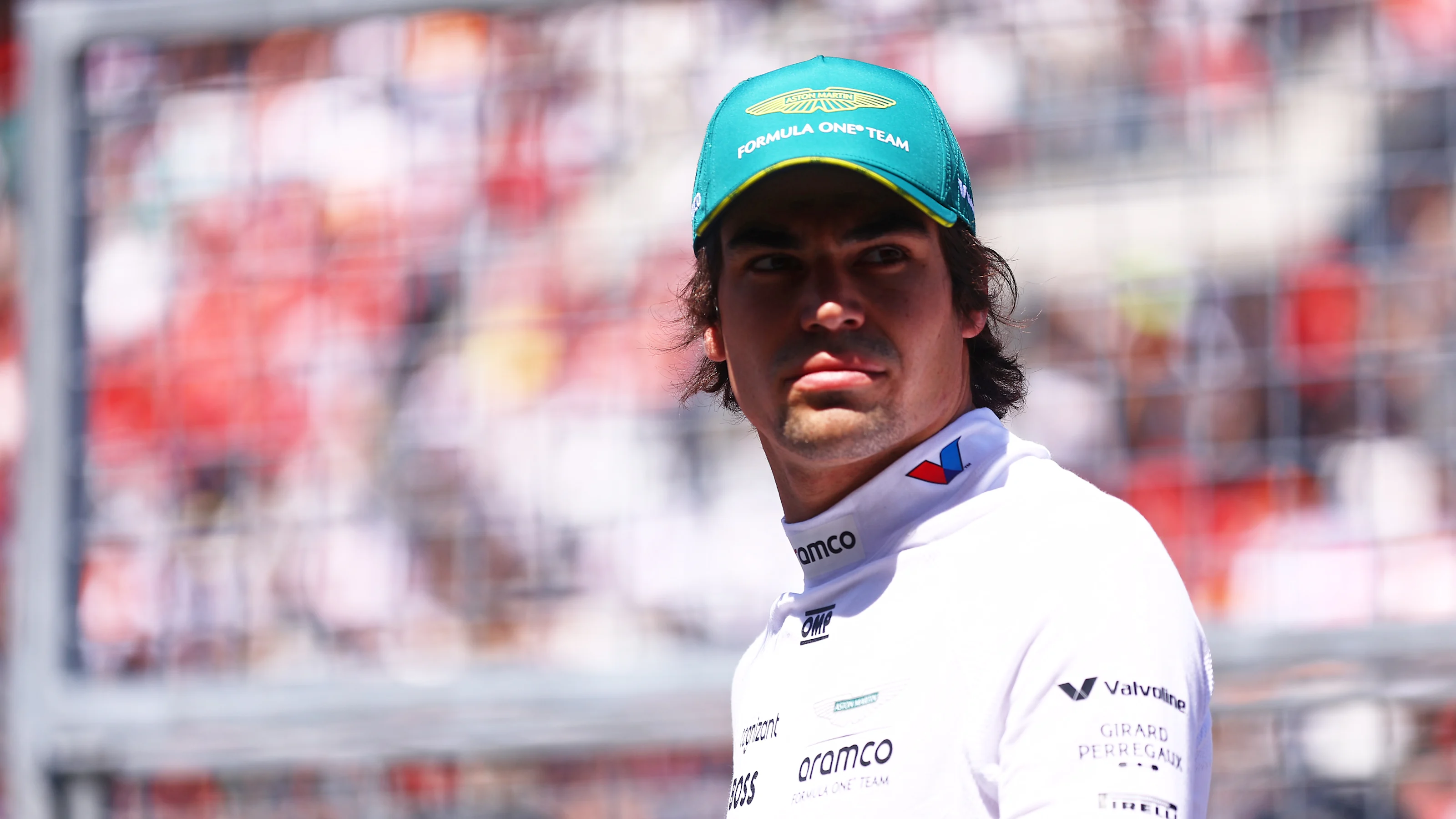 SUZUKA, JAPAN - APRIL 07: Lance Stroll of Canada and Aston Martin F1 Team looks on from the grid