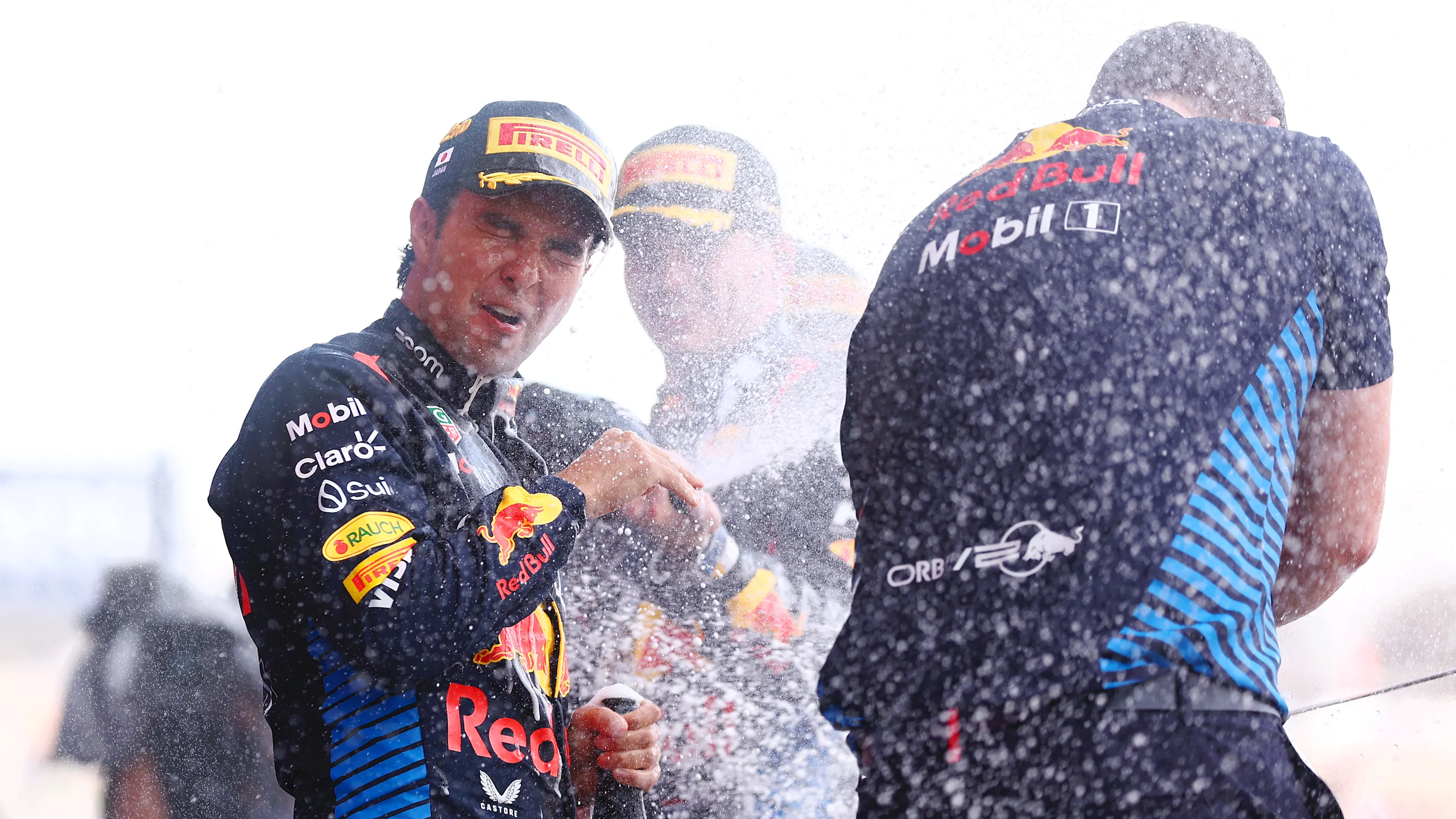 SUZUKA, JAPAN - APRIL 07: Second placed Sergio Perez of Mexico and Oracle Red Bull Racing